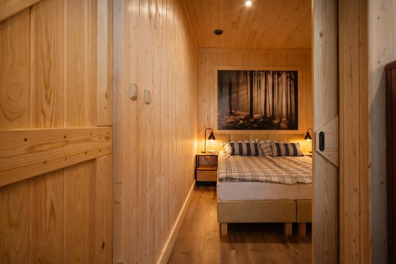 Bed in Apartamenty Leśna Przystań nad jeziorem