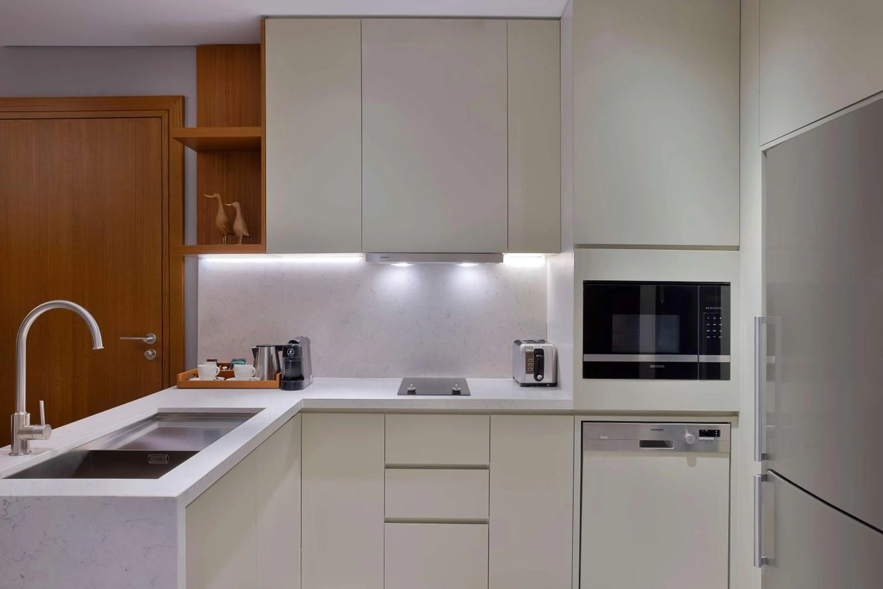Kitchen or kitchenette in DoubleTree by Hilton Sharjah Waterfront Hotel And Residences
