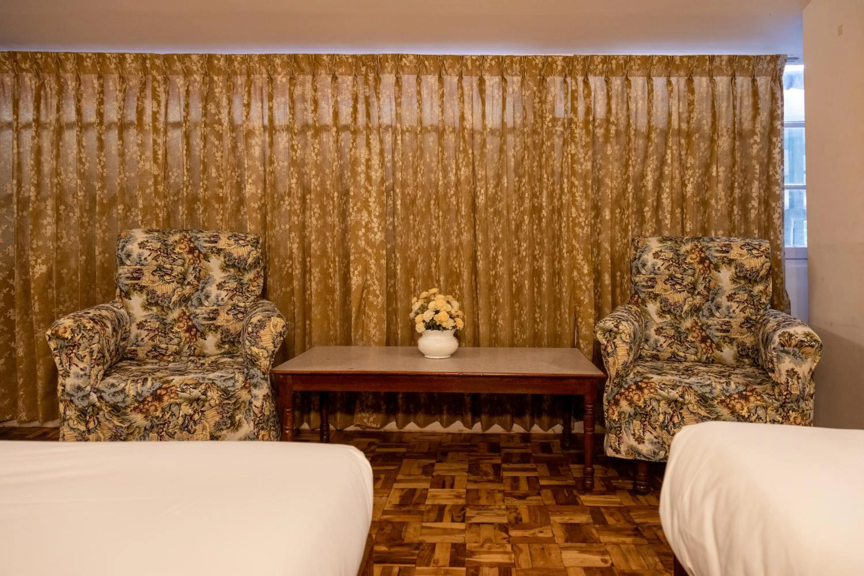 Seating area, Bed in Aakash Rooms and Cottages,