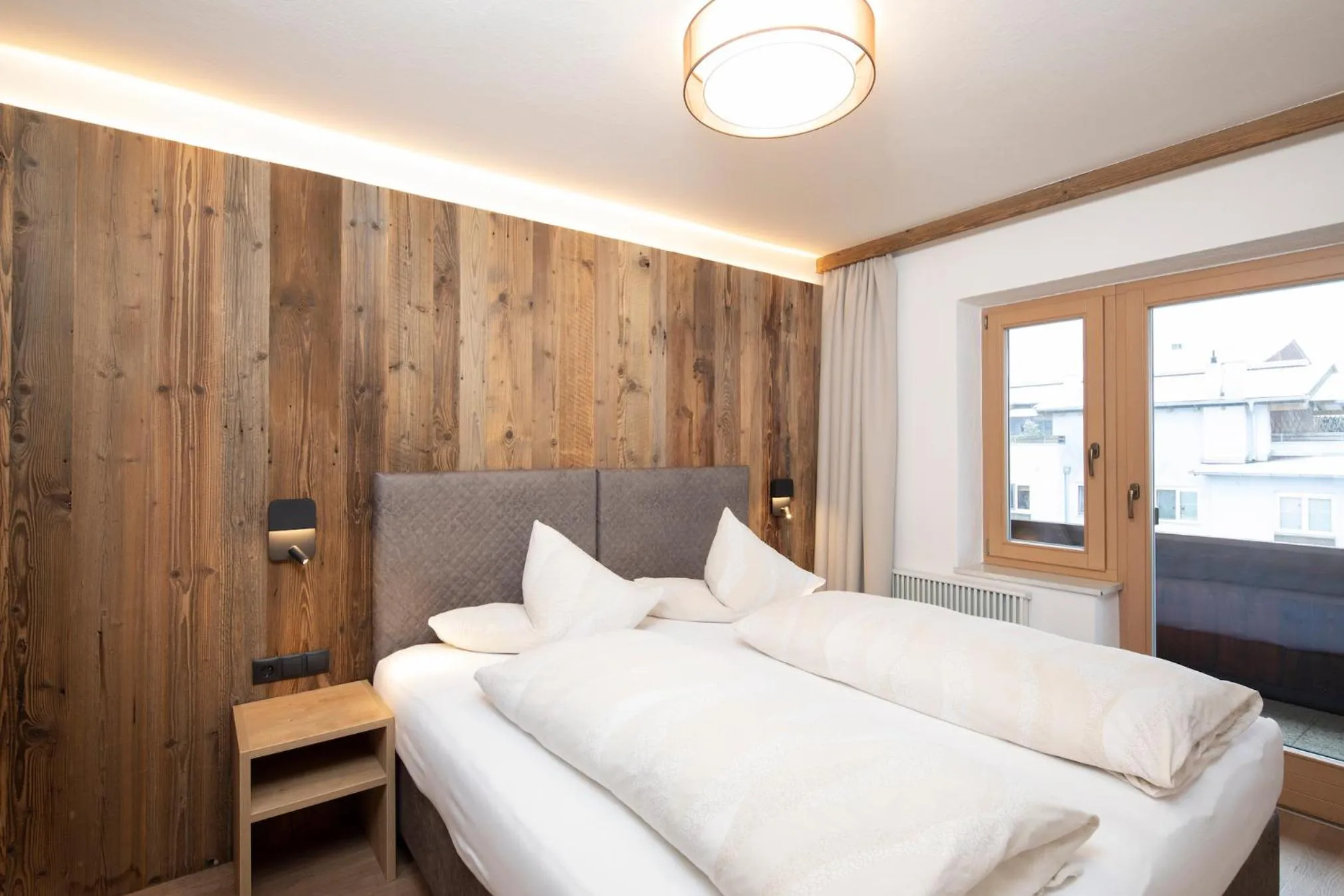 Bed in Angerer Alpine Suiten und Familienappartements Tirol