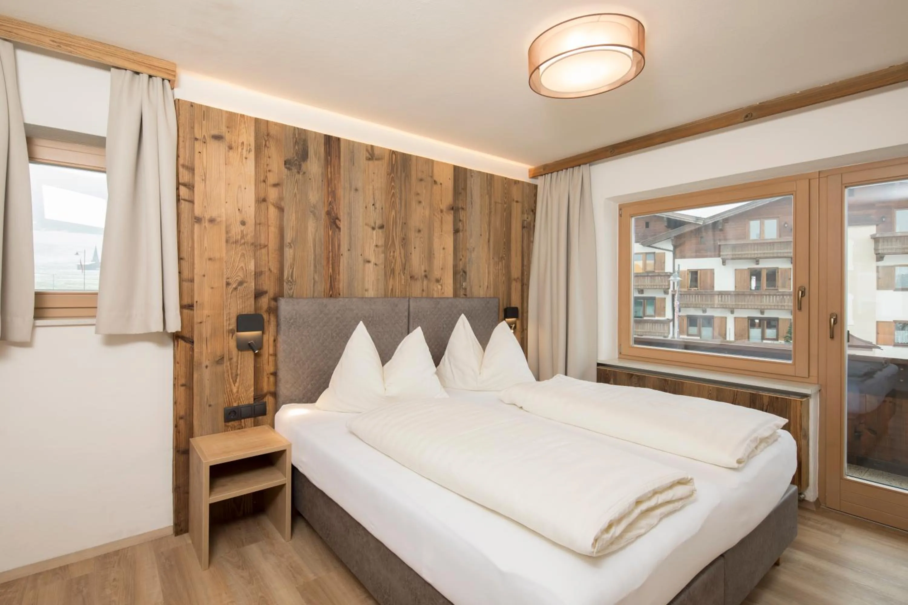 Bed in Angerer Alpine Suiten und Familienappartements Tirol
