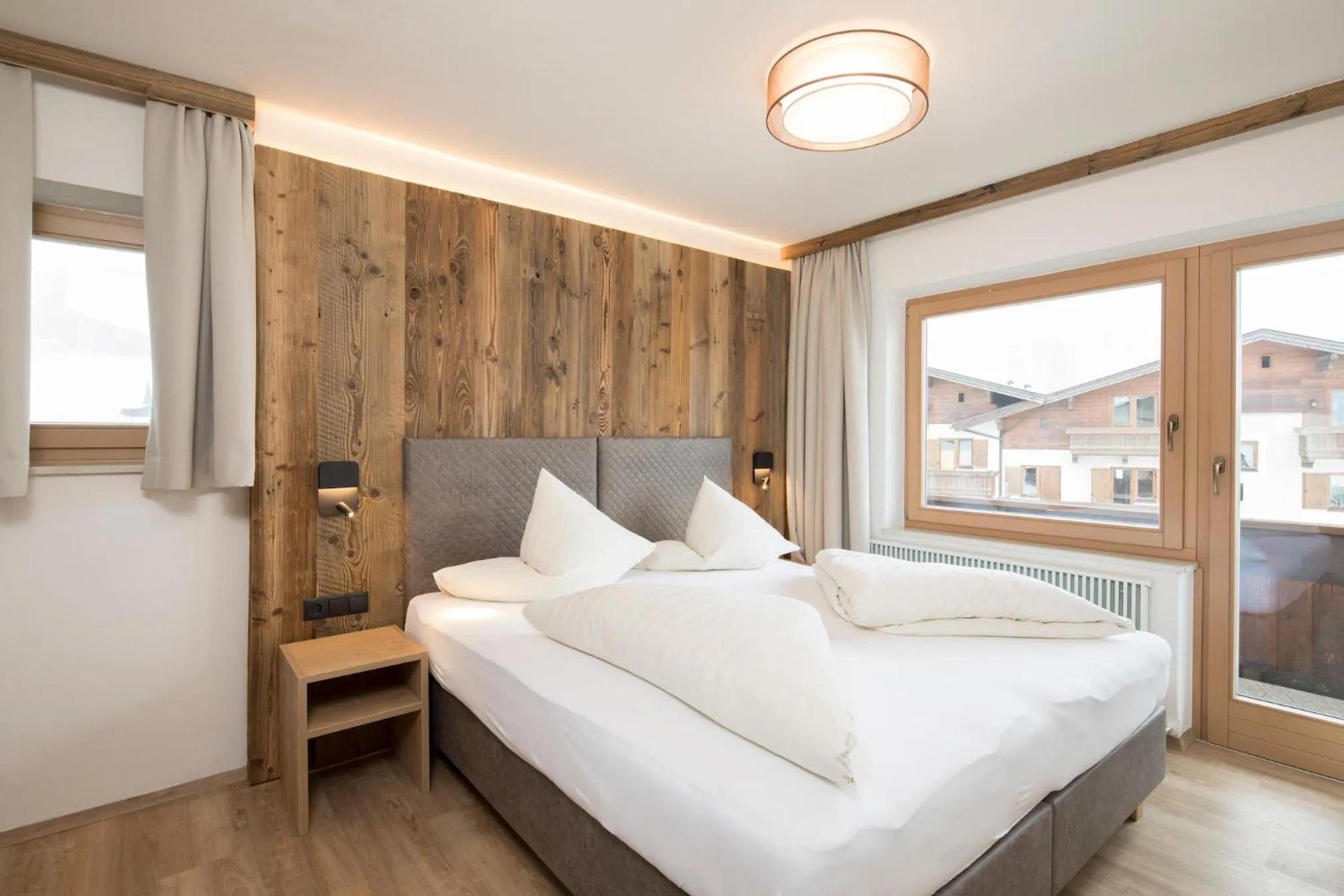 Bed in Angerer Alpine Suiten und Familienappartements Tirol