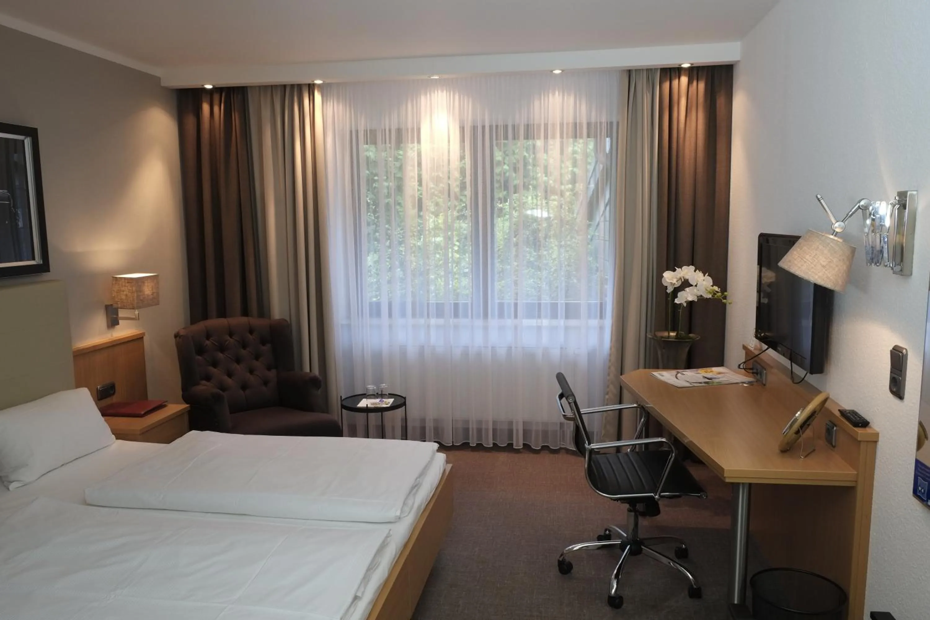 Photo of the whole room, Bed in Hotel Brunnenhof International