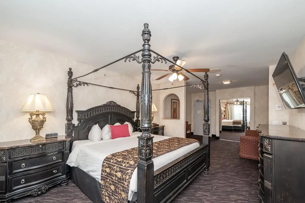 Bed in Bellissimo Hotel, Trademark by Wyndham Near Foxwoods Casino