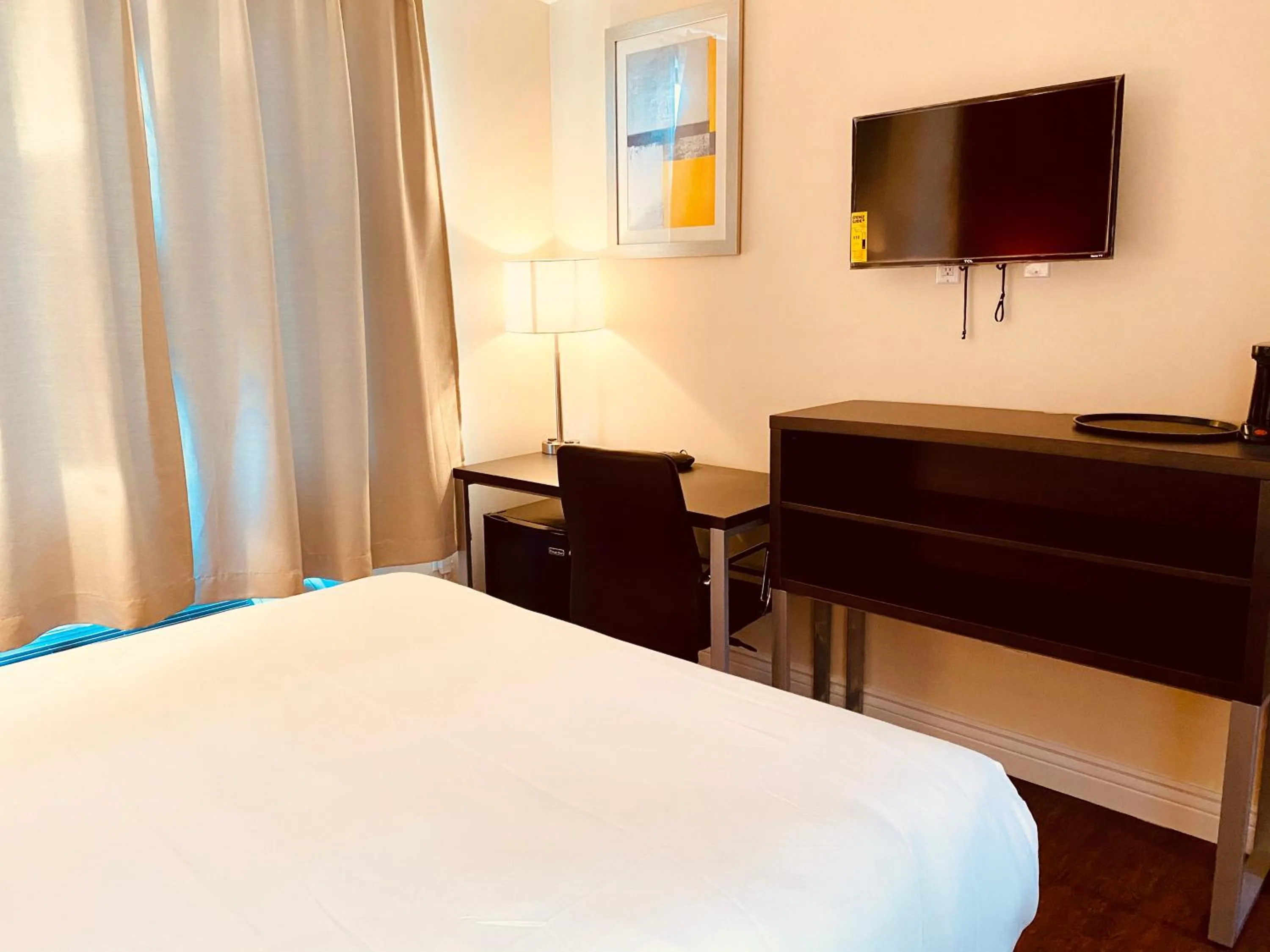 Bedroom, TV/Entertainment Center in Surface Inn Brooklyn