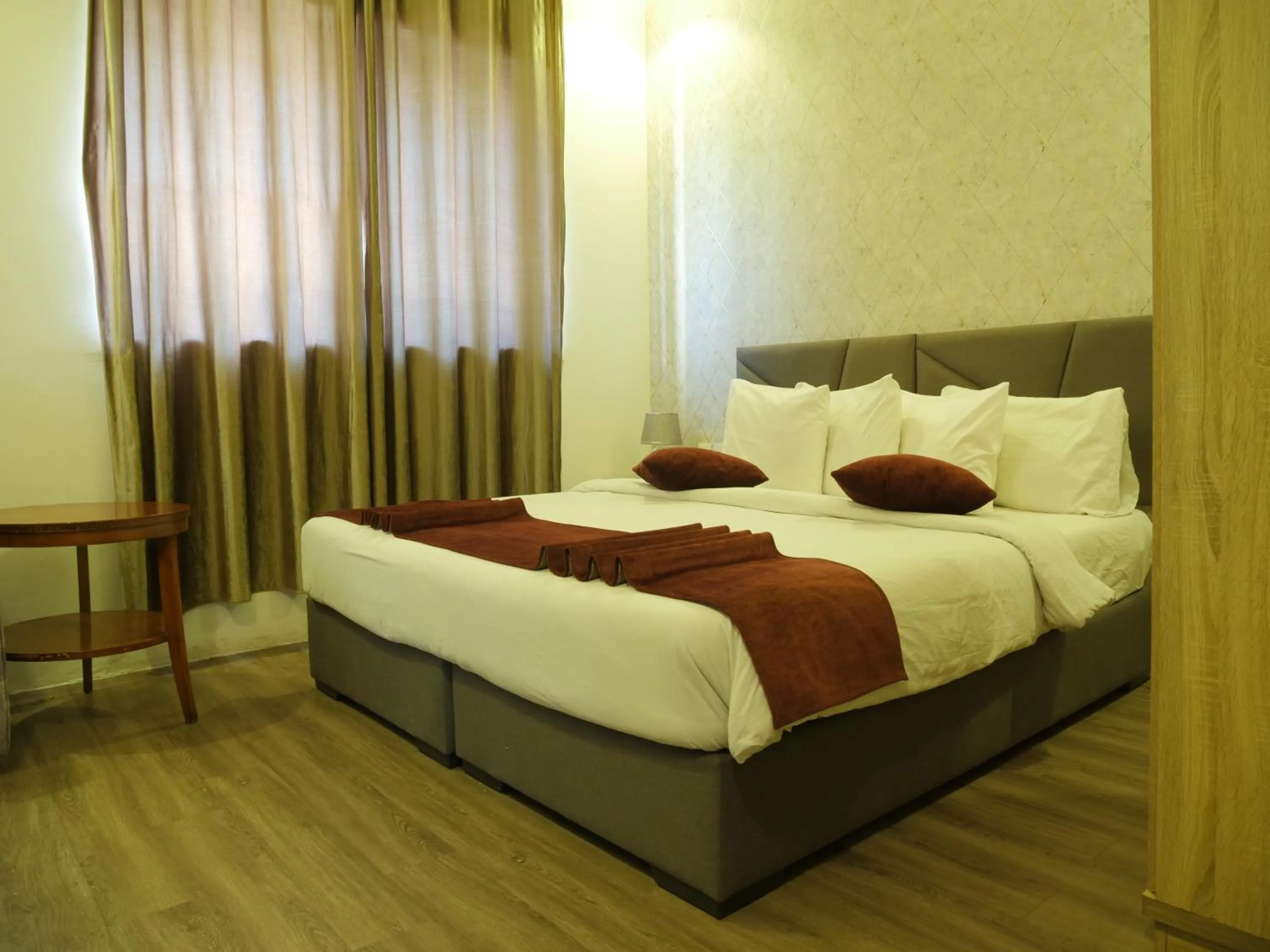 Bed in Twins Downtown Hotel