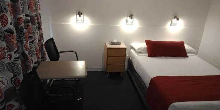 Bed in Lake Munmorah Motel