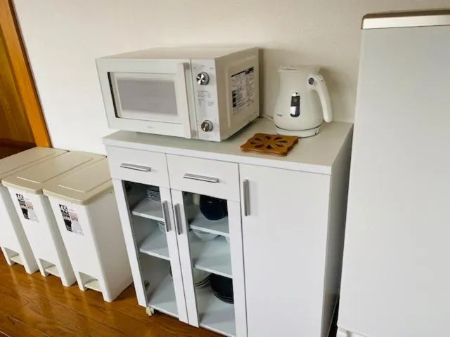Kitchen or kitchenette in Ostay Numabukuro Hotel Apartment