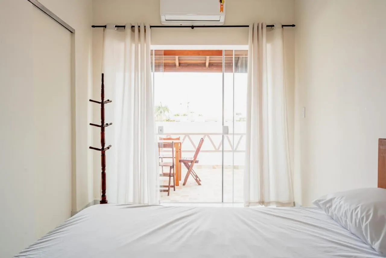 Balcony/Terrace, Bed in Pousada Oásis