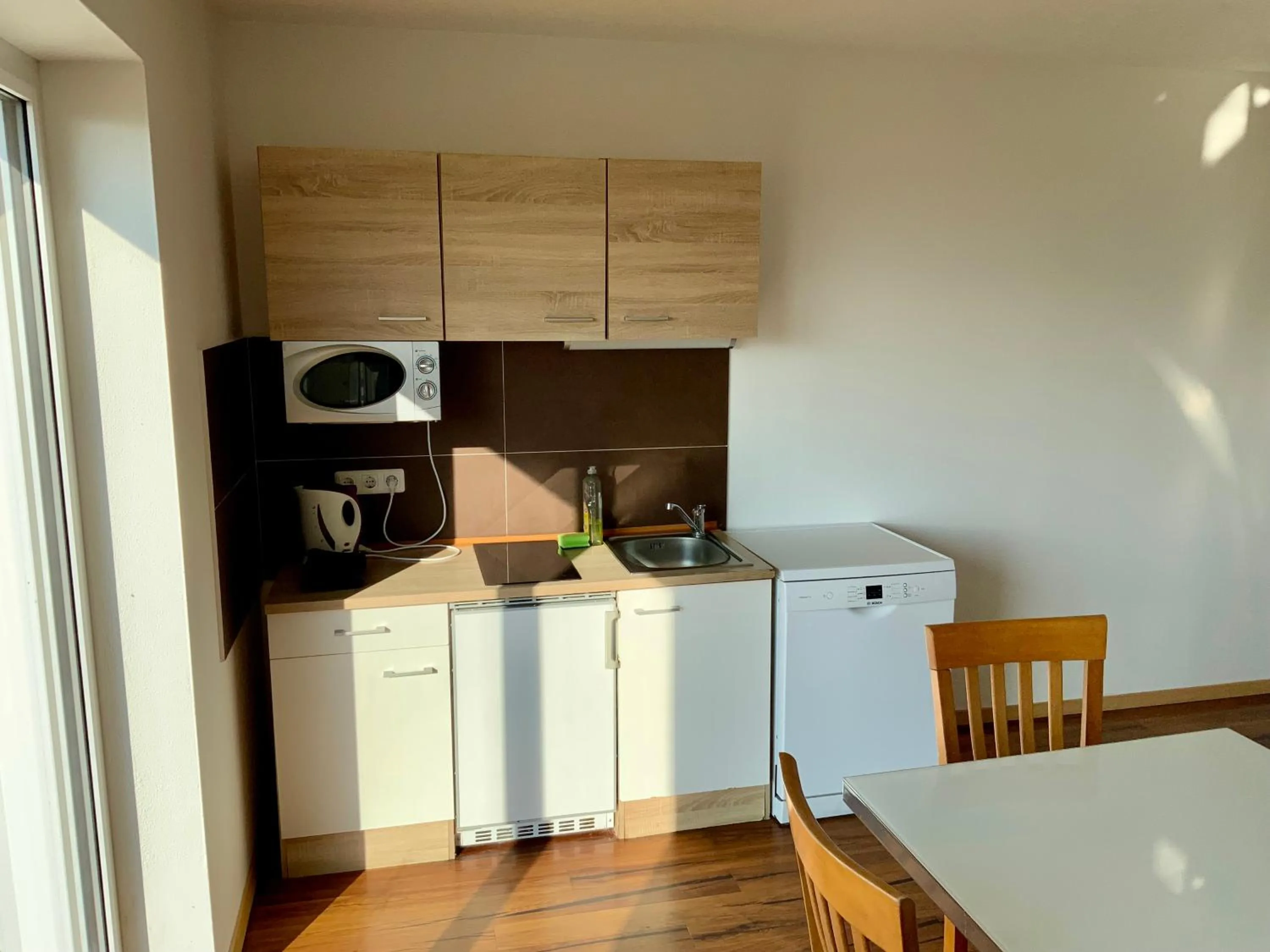 Kitchen or kitchenette in Geinberg Suites & Via Nova Lodges