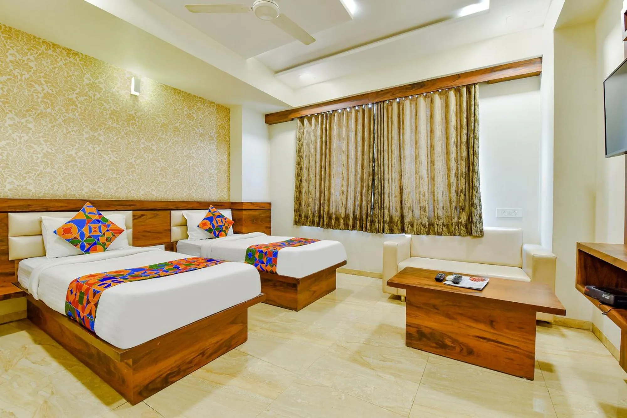 TV and multimedia, Bed in FabHotel Hill Park - Inside Suryam Trade Center