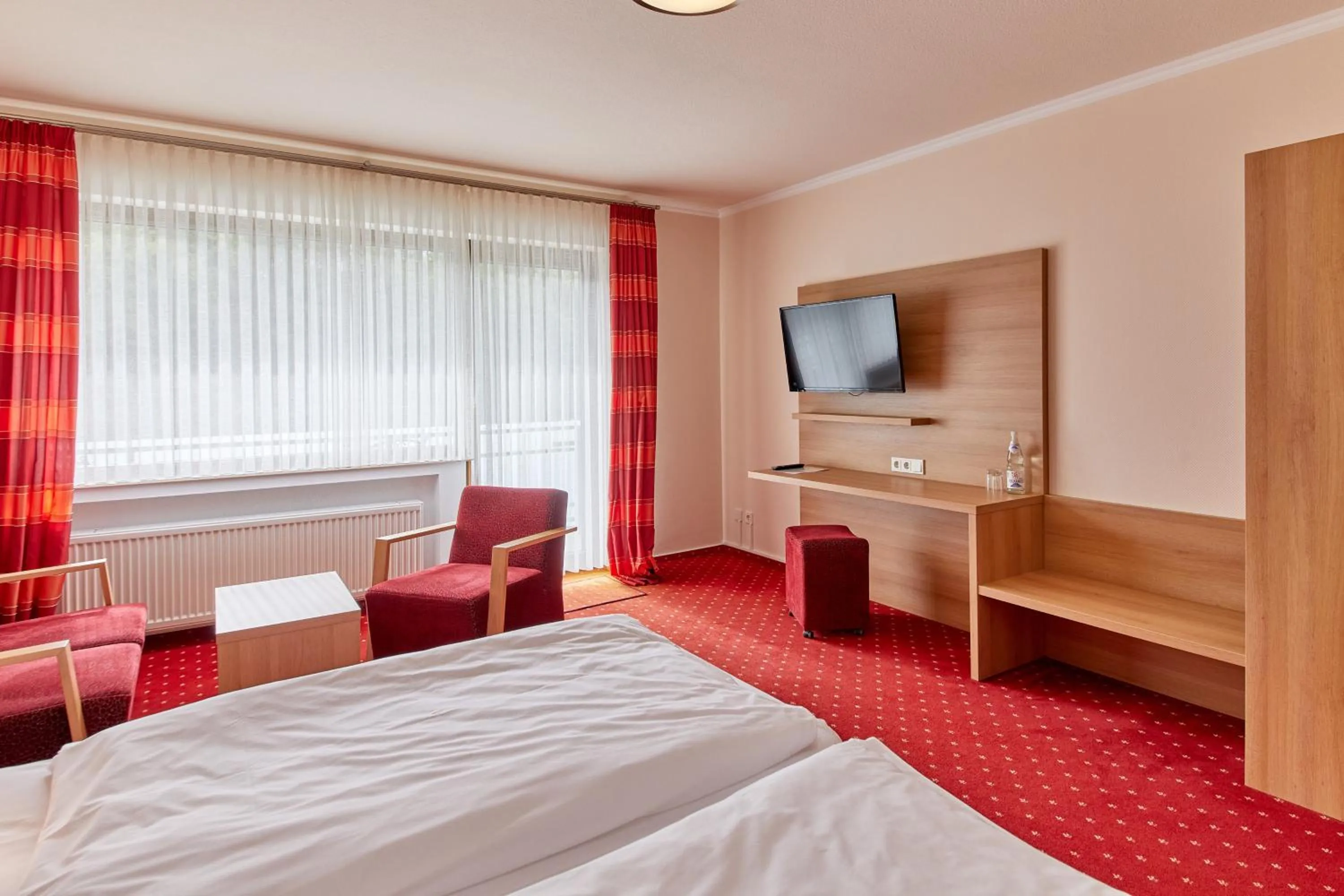 Seating area, Bed in Hotel Café Ernst