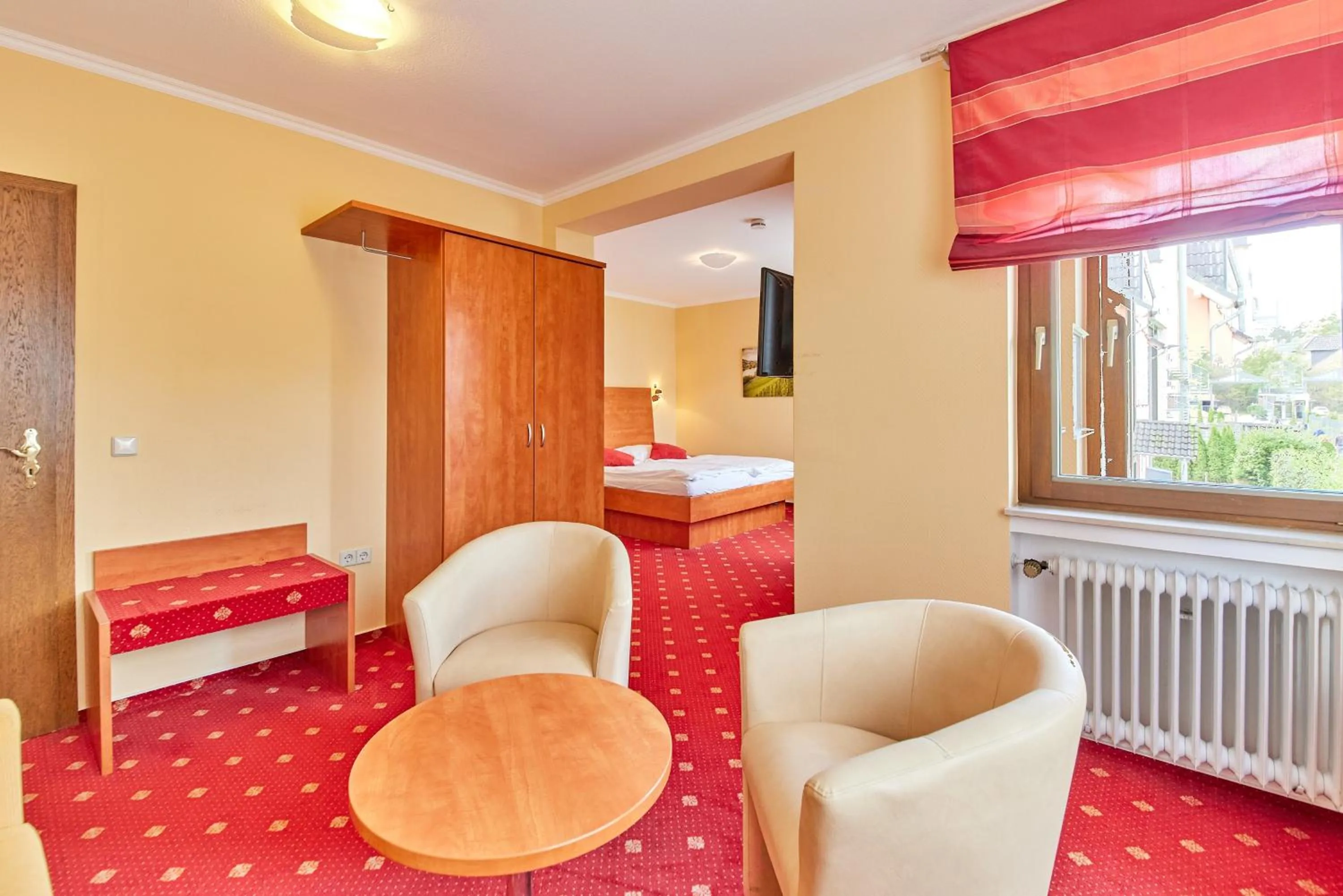 Seating area, Bed in Hotel Café Ernst