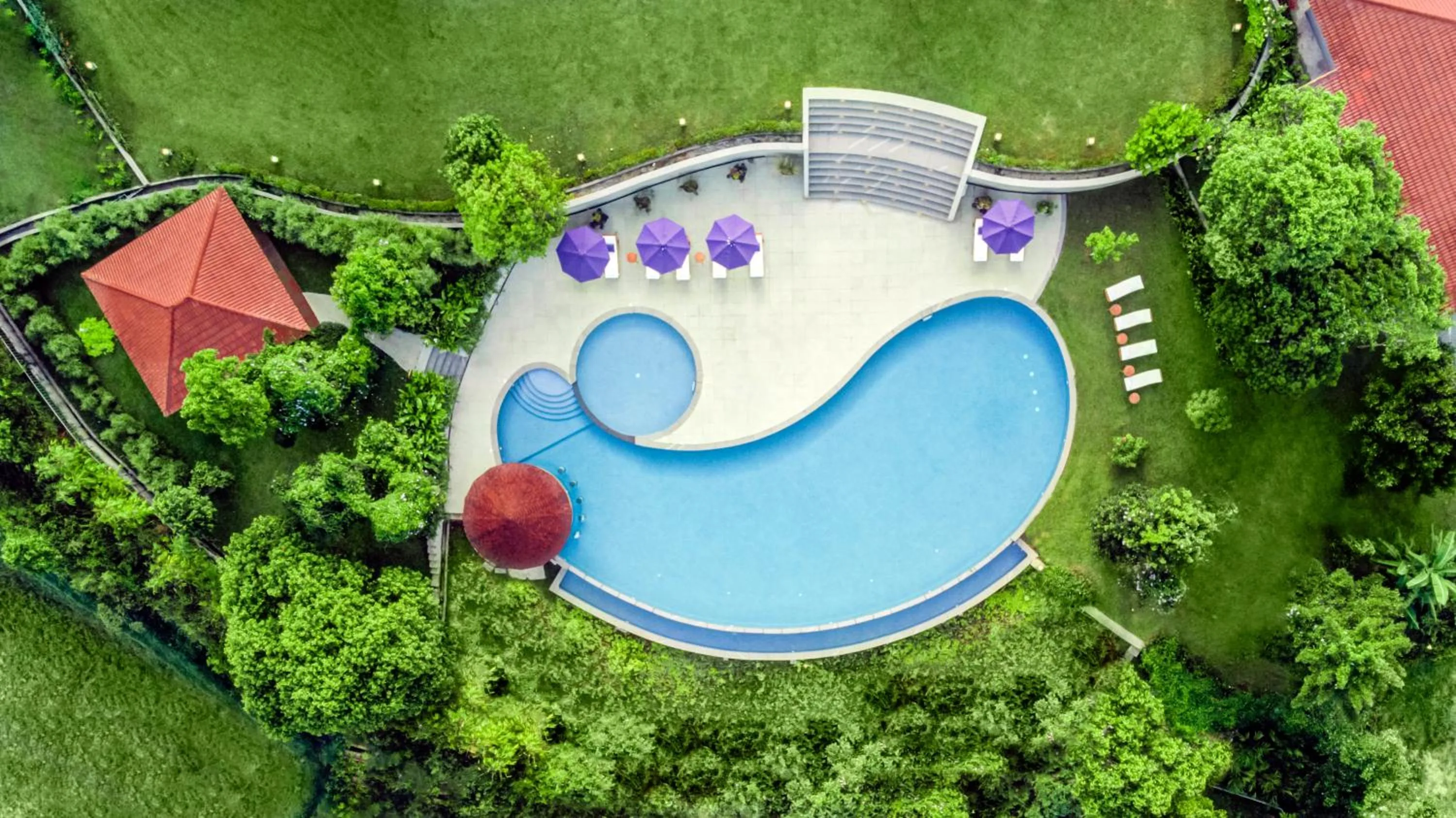 Swimming pool in Aurika, Coorg Luxury by Lemon Tree Hotels