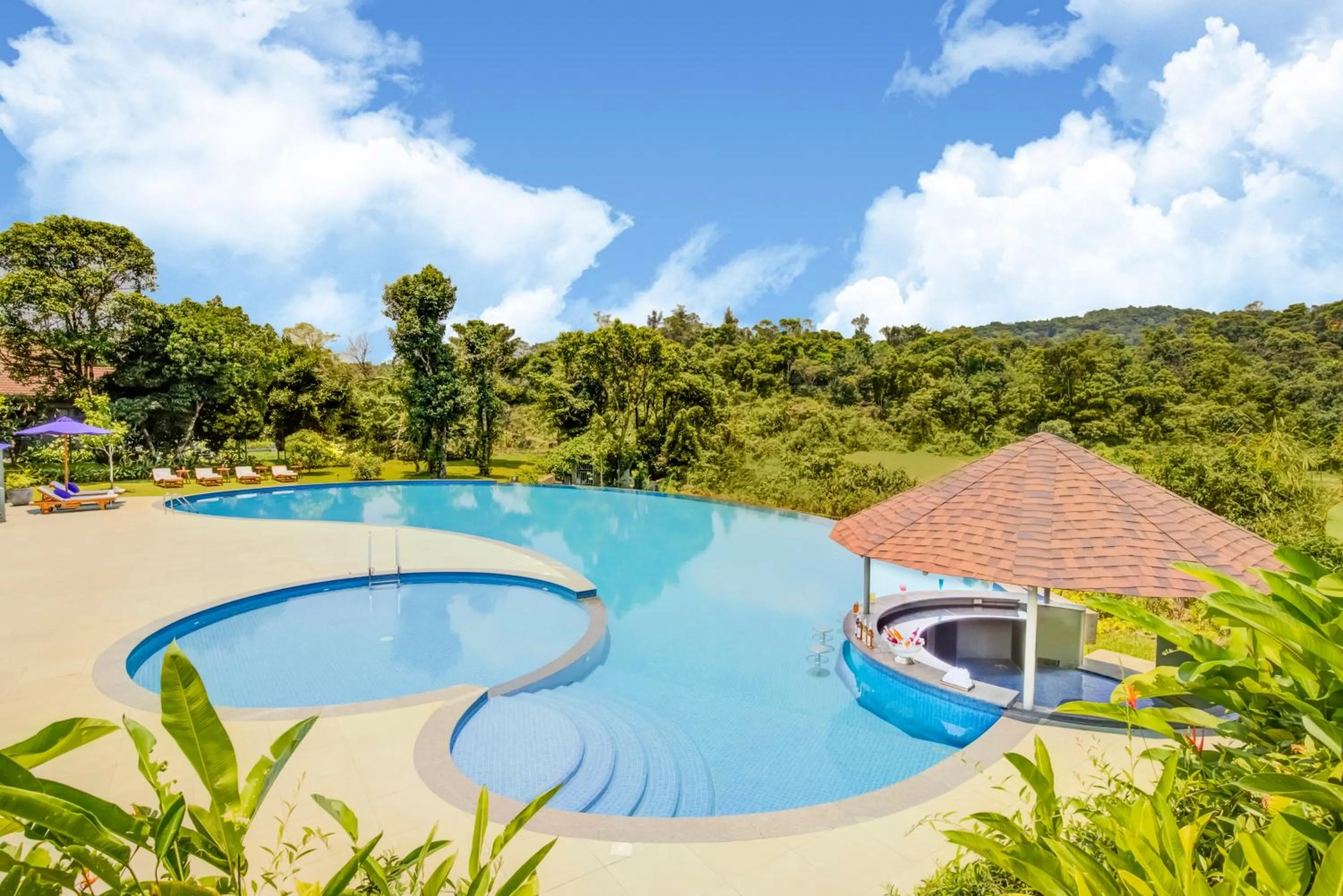 Swimming pool in Aurika, Coorg Luxury by Lemon Tree Hotels