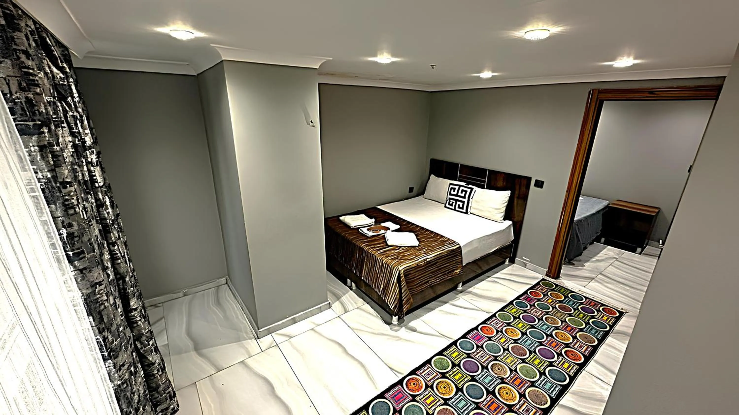 Bed in Grand Lara Hotel & Apartments