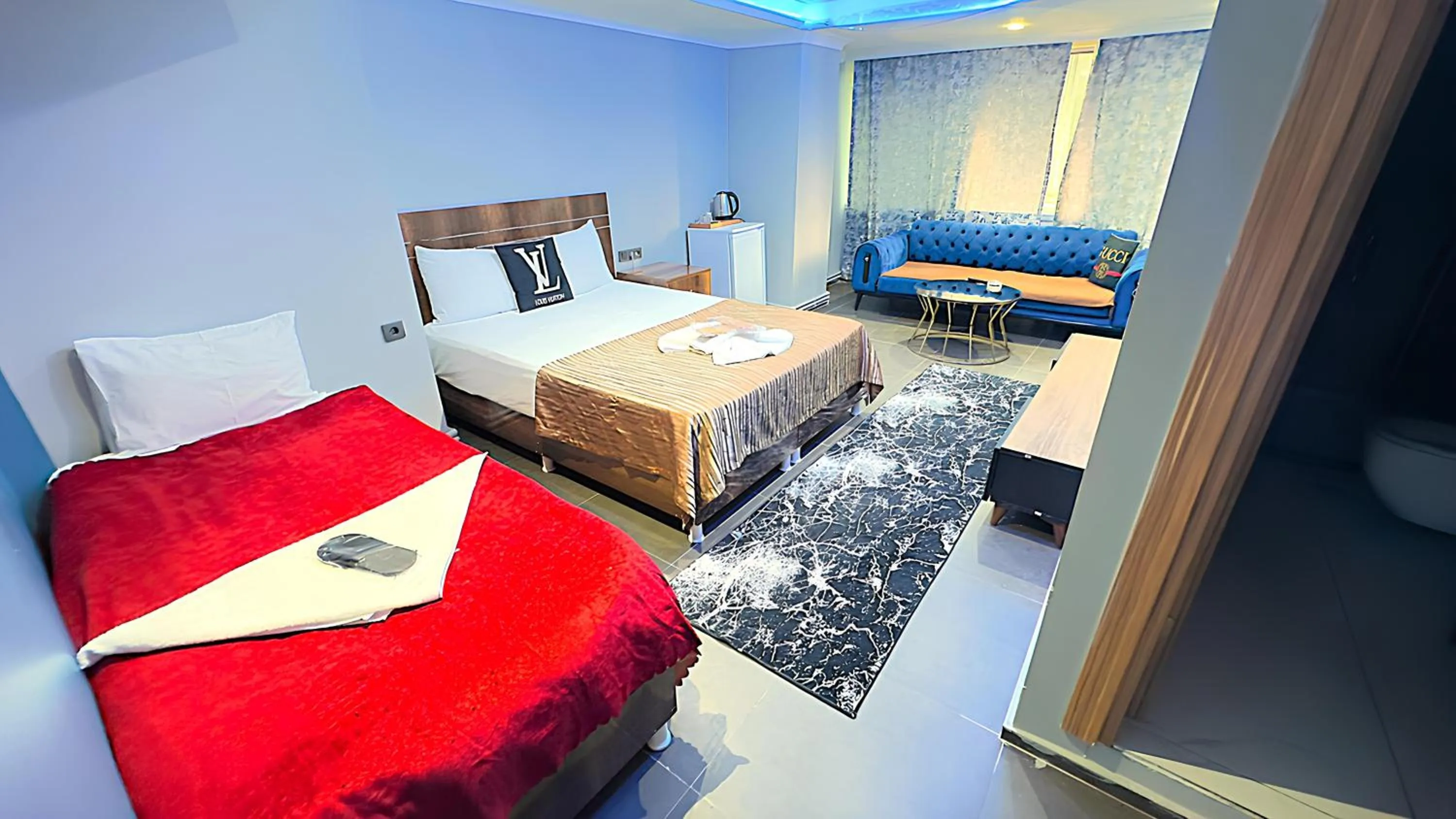 Bed in Grand Lara Hotel & Apartments