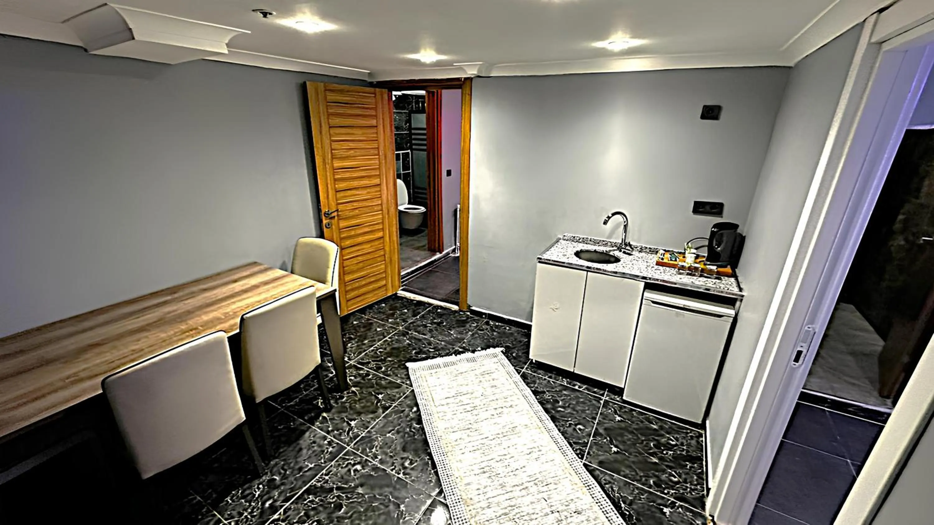 Kitchen or kitchenette in Grand Lara Hotel & Apartments