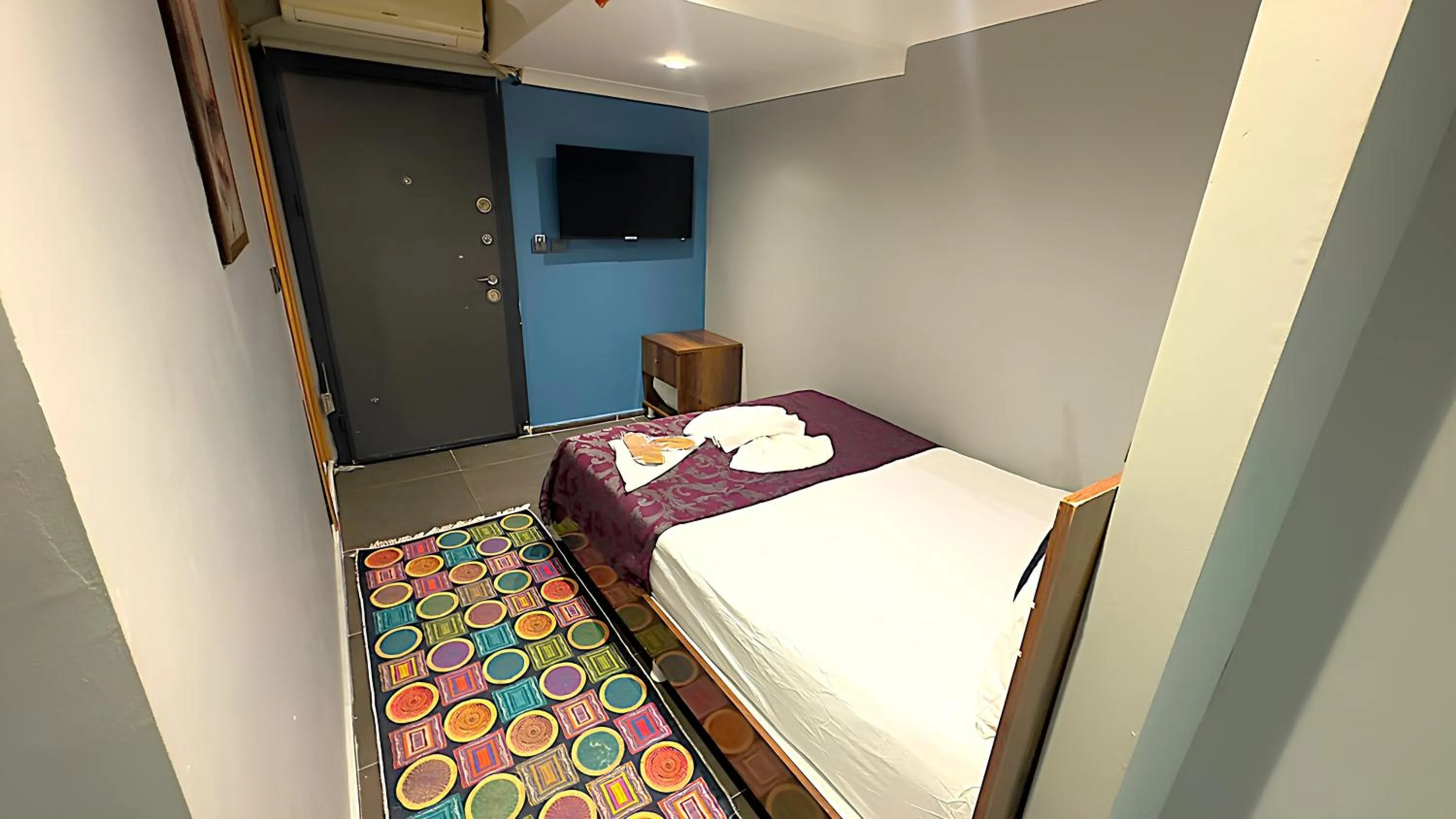 Bed in Grand Lara Hotel & Apartments