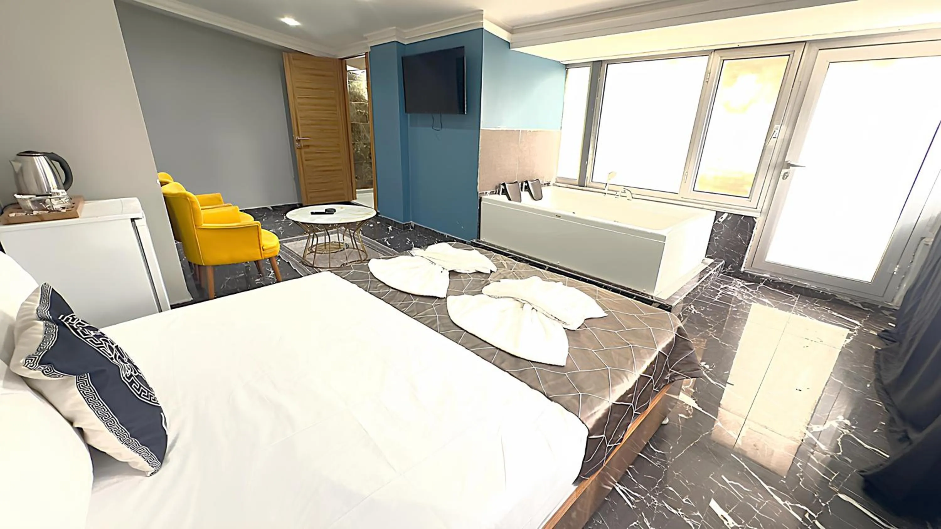 Bed in Grand Lara Hotel & Apartments