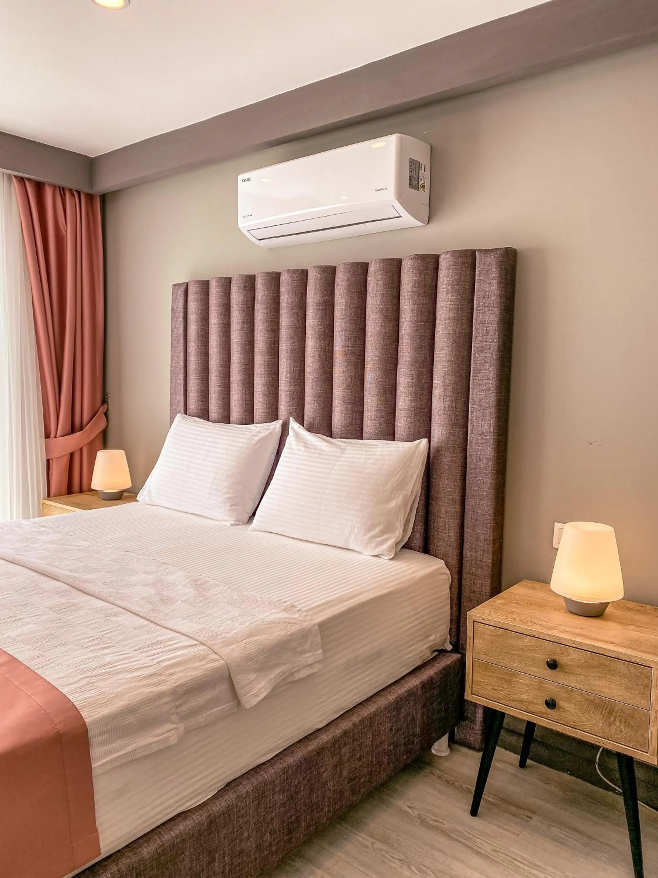 Bed in L'opera Deluxe Hotel