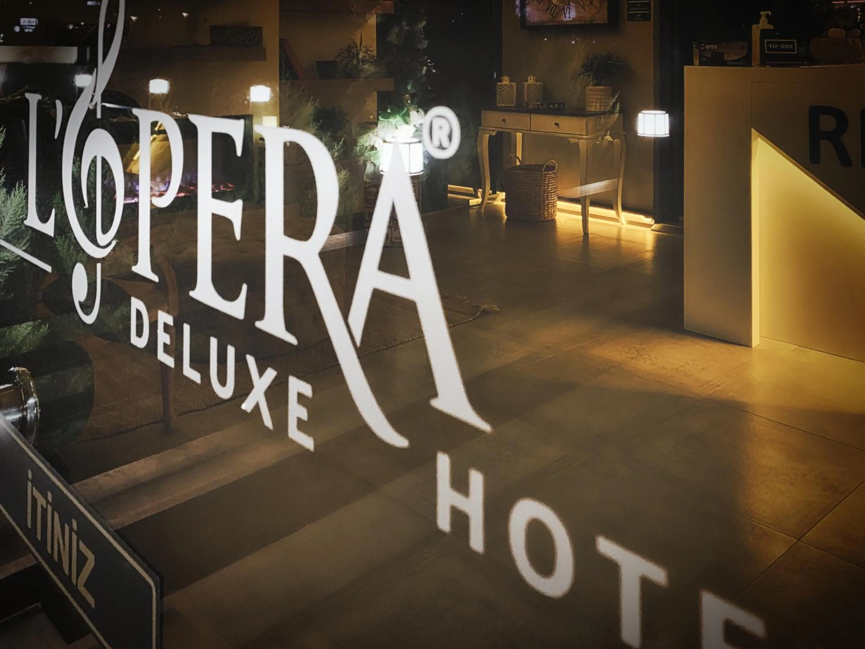 Property logo or sign in L'opera Deluxe Hotel