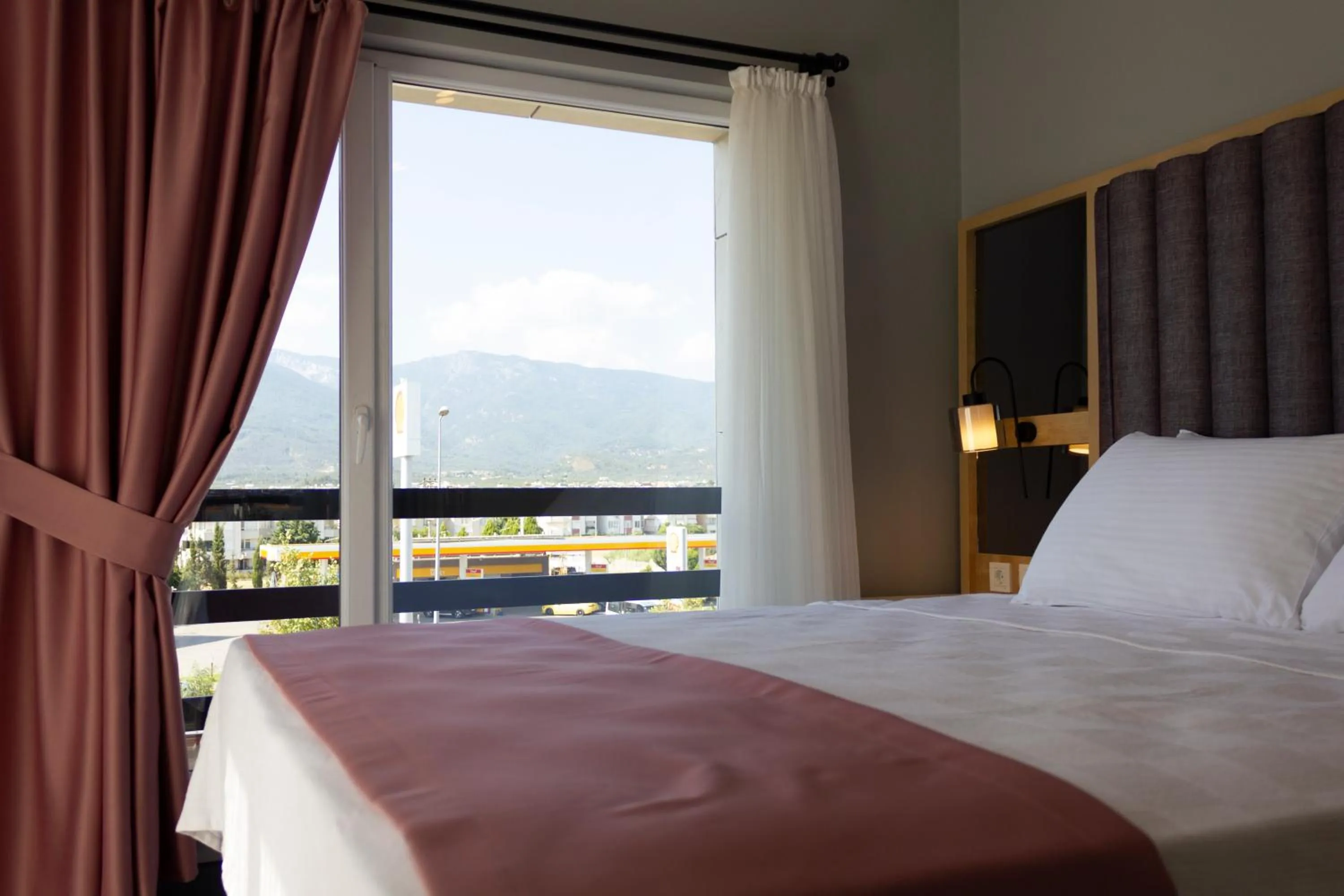 Bed in L'opera Deluxe Hotel