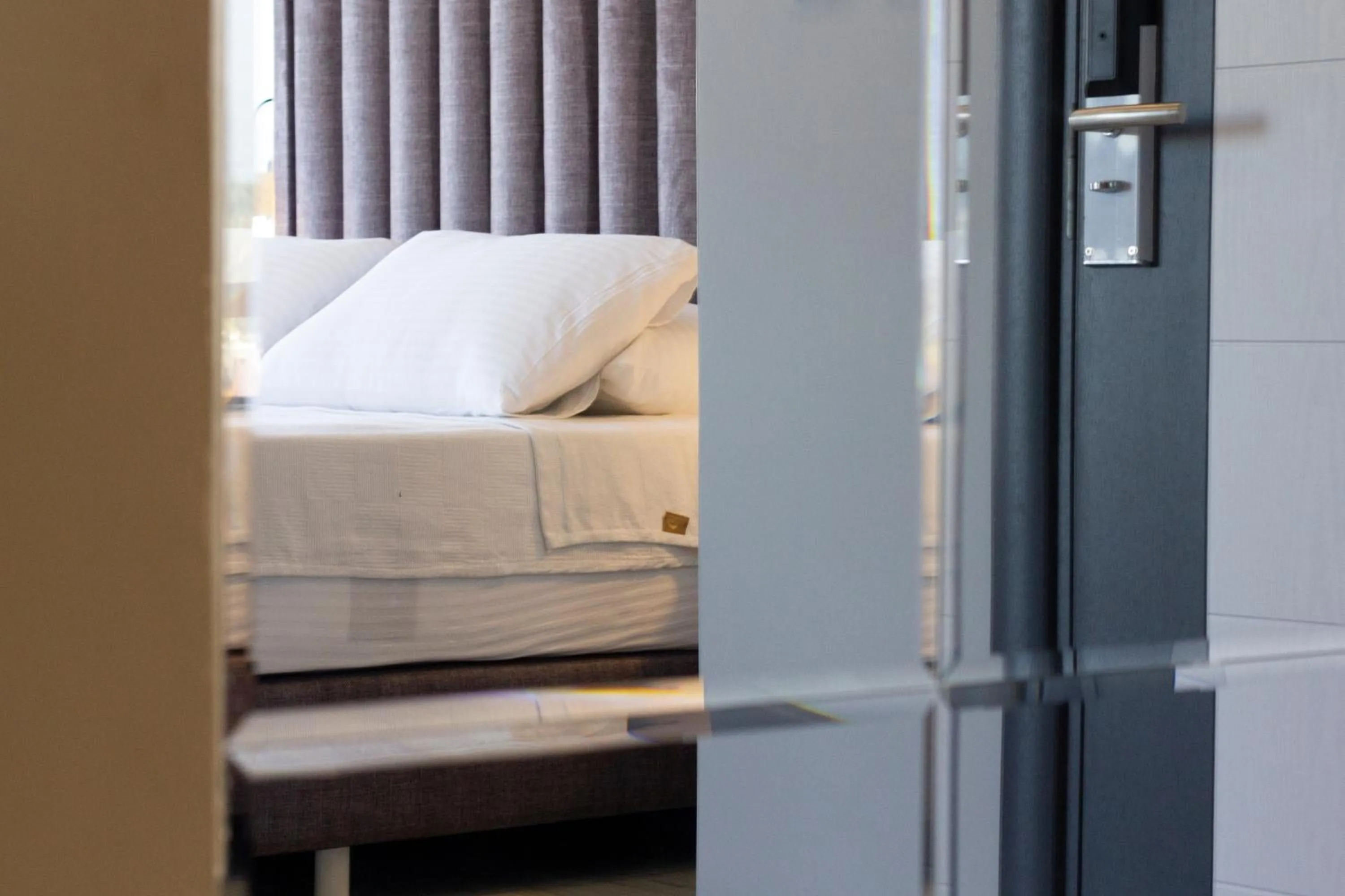 Bed in L'opera Deluxe Hotel