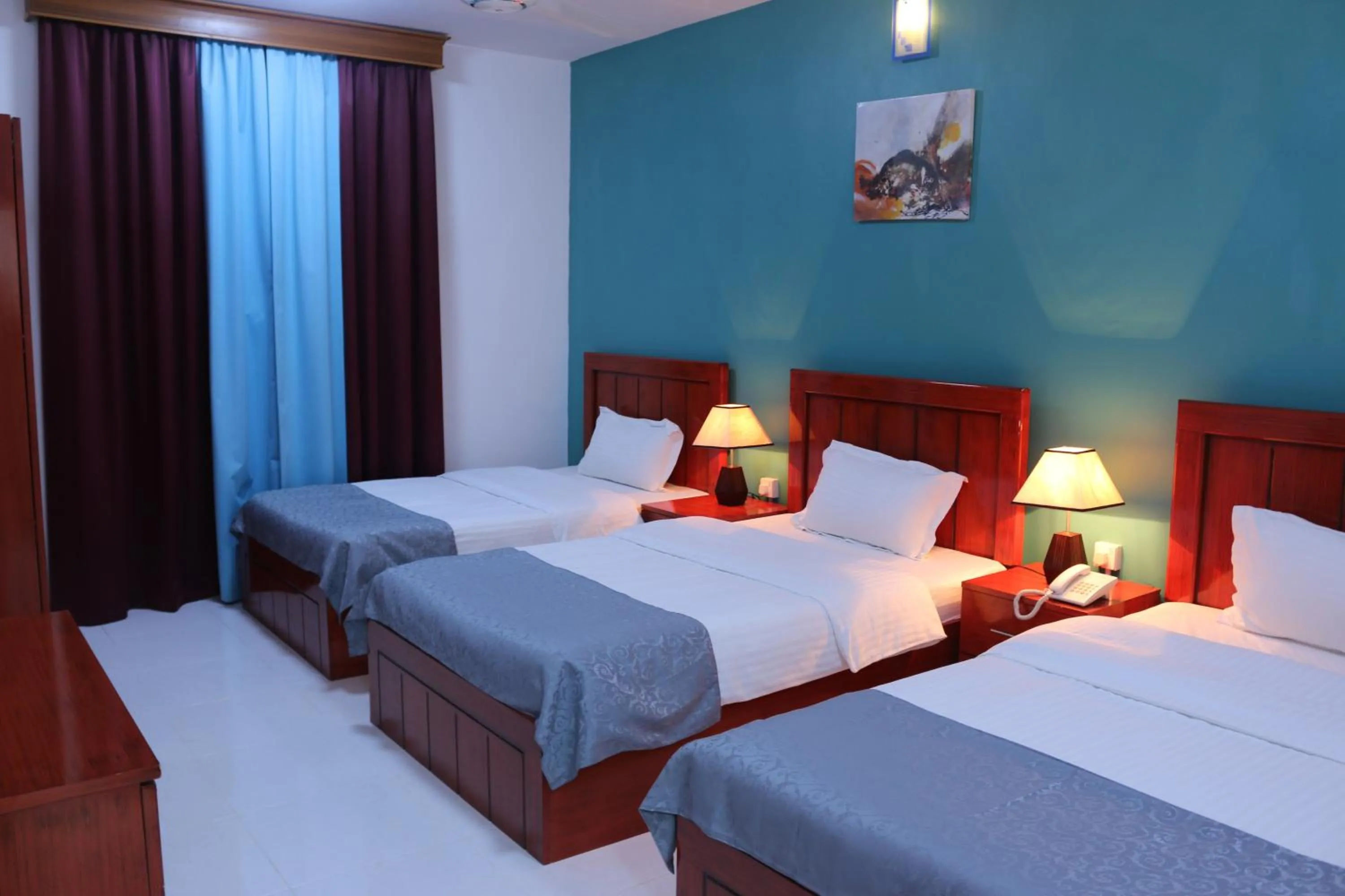 Bed in Al Karam Hotel Apartment