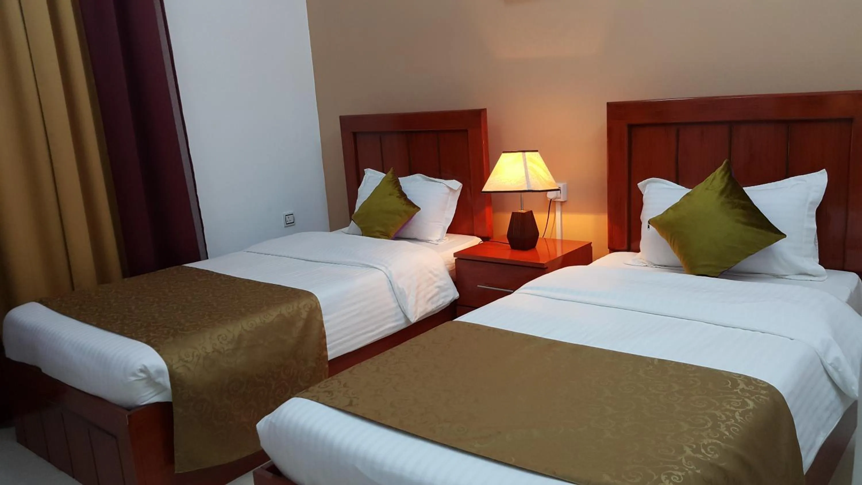 Bed in Al Karam Hotel Apartment