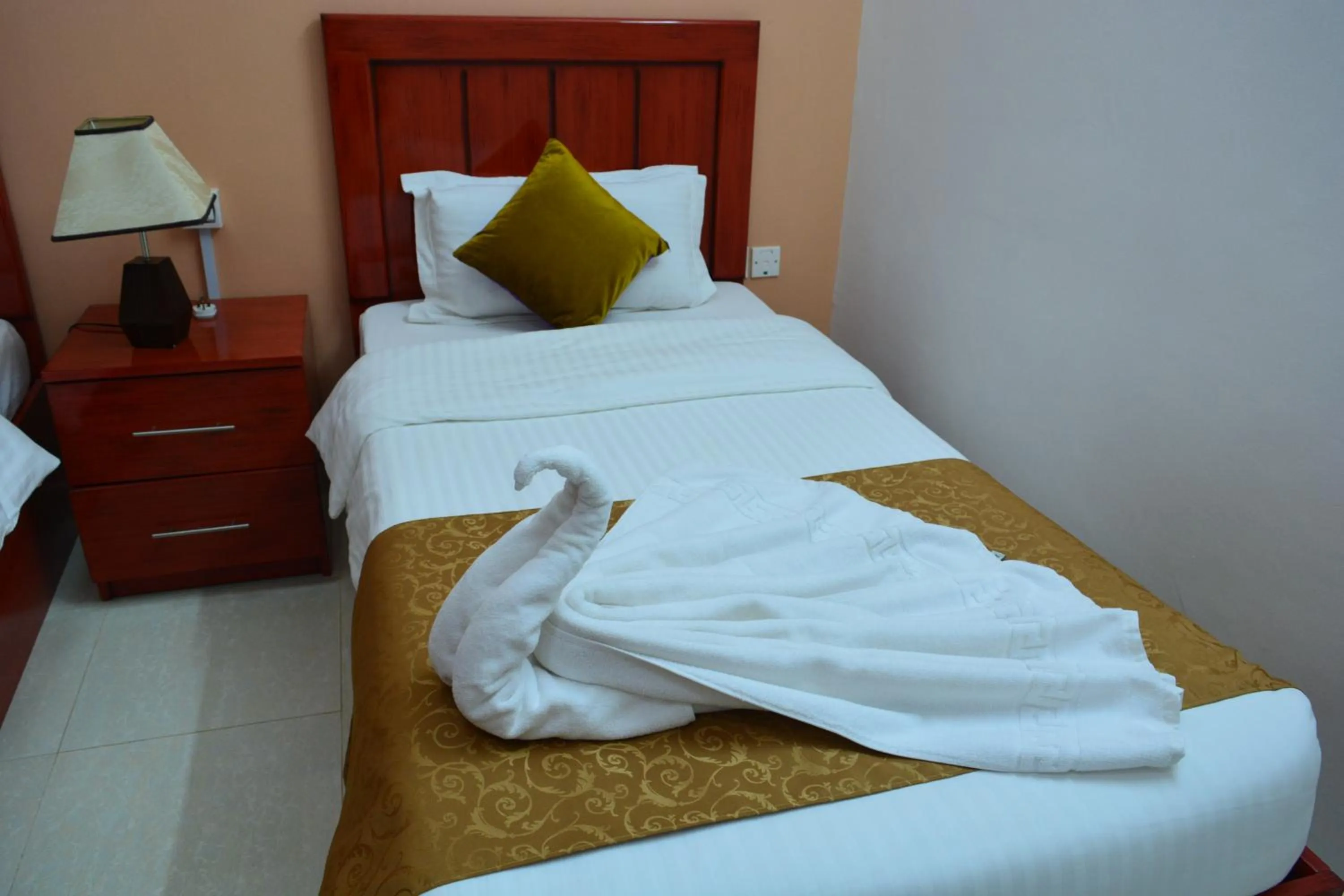 Bed in Al Karam Hotel Apartment