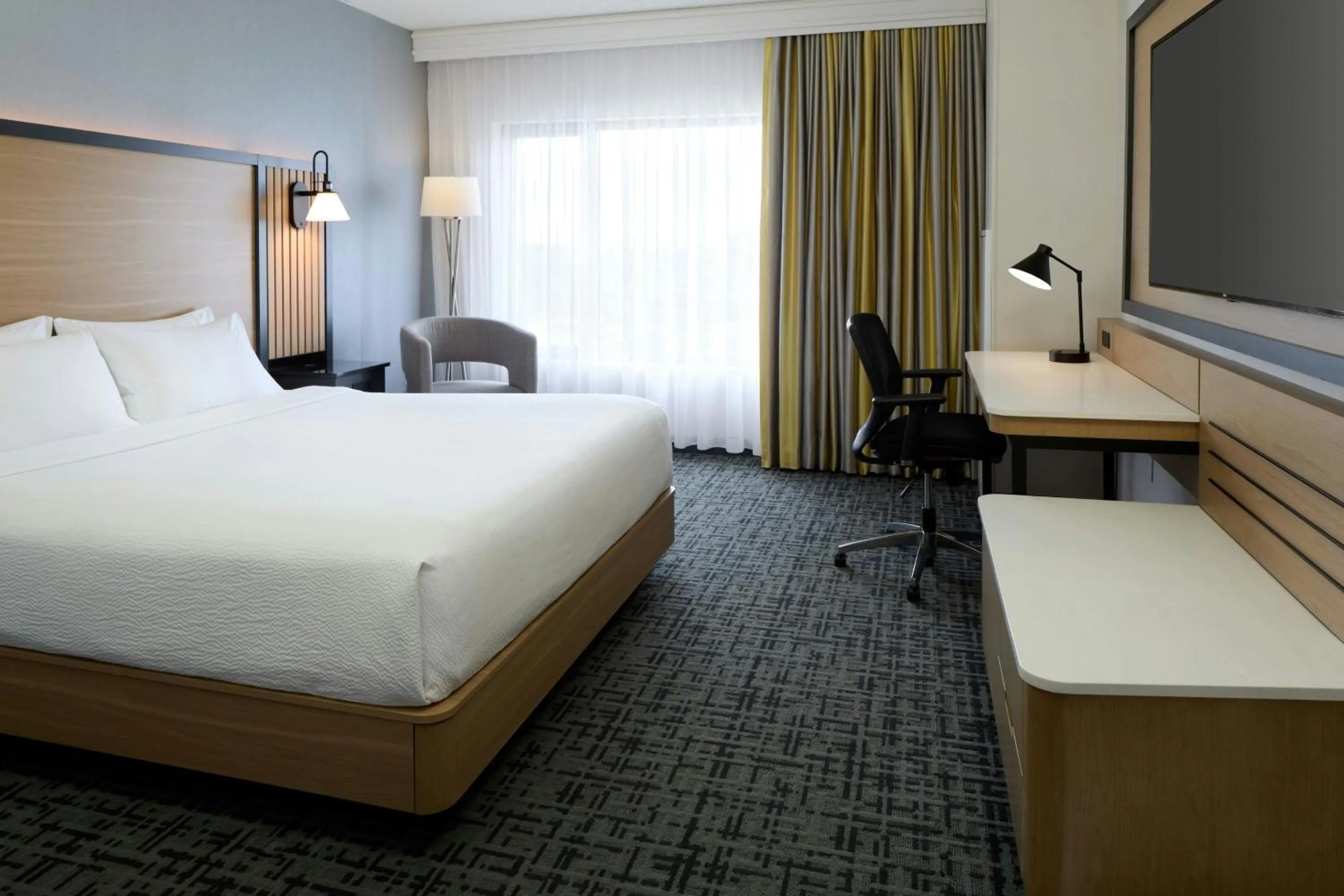 Photo of the whole room, Bed in Fairfield Inn & Suites by Marriott Montreal Airport