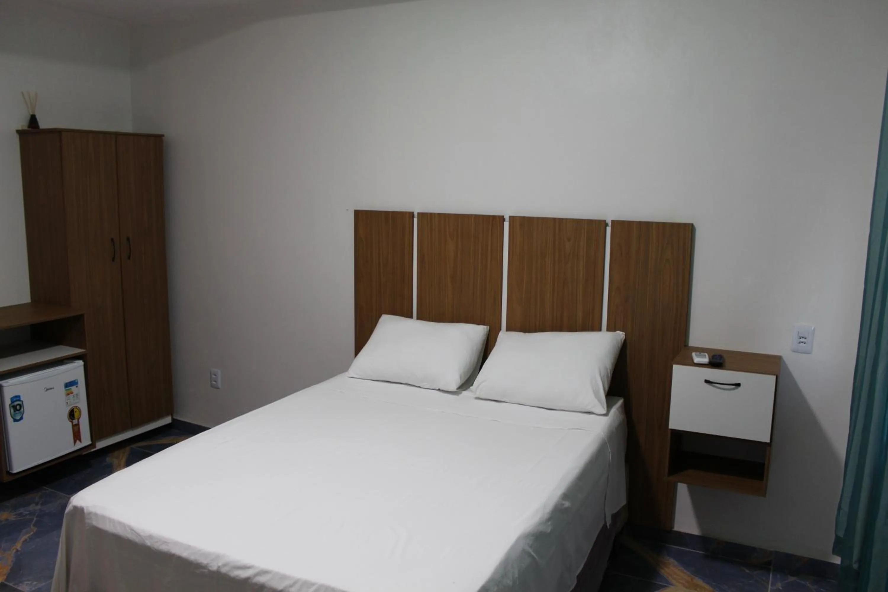 Bed in Hotel Jardim Tropical