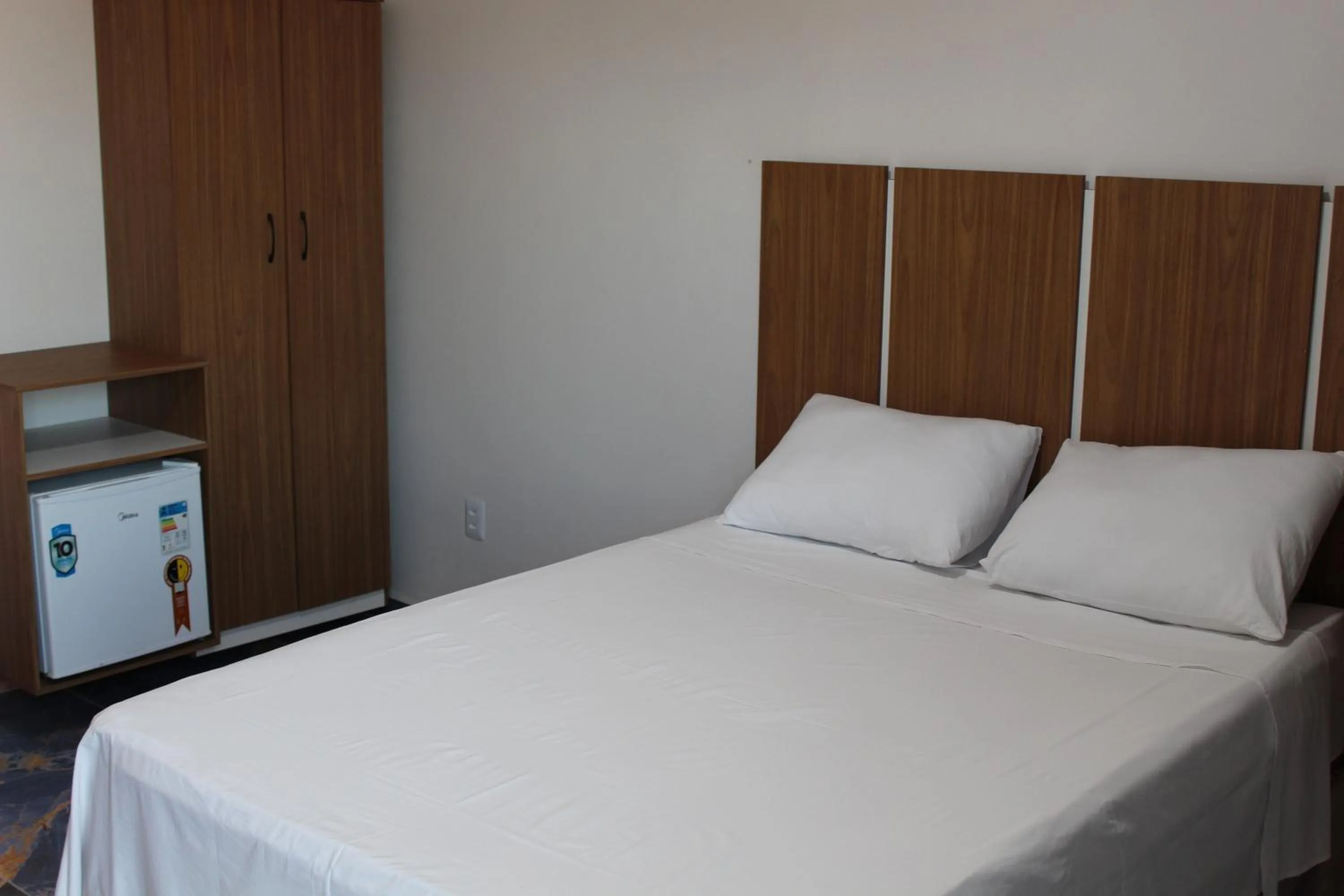 Bed in Hotel Jardim Tropical