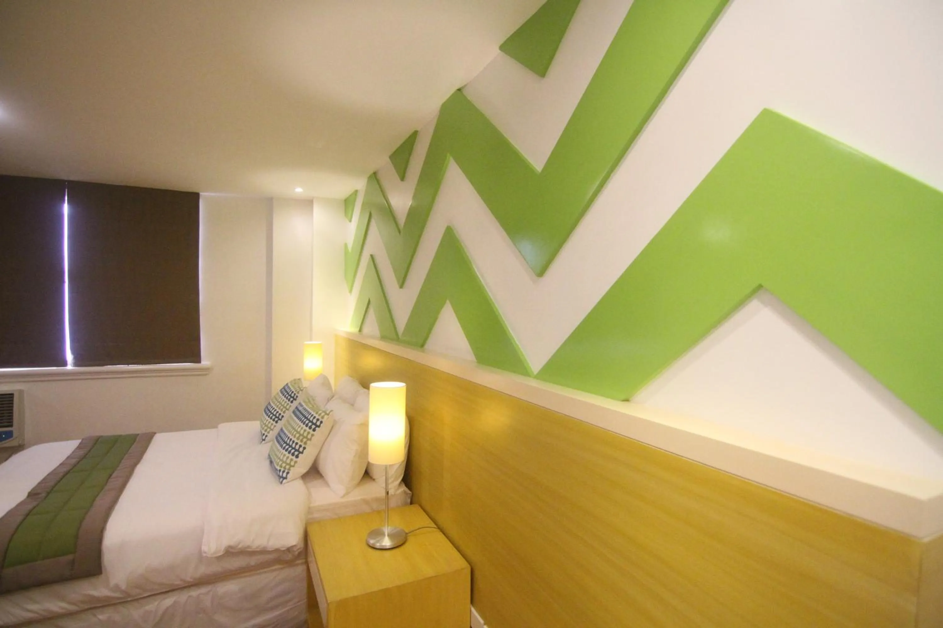 Bed in Bryan Condo Suites Makati near Airport