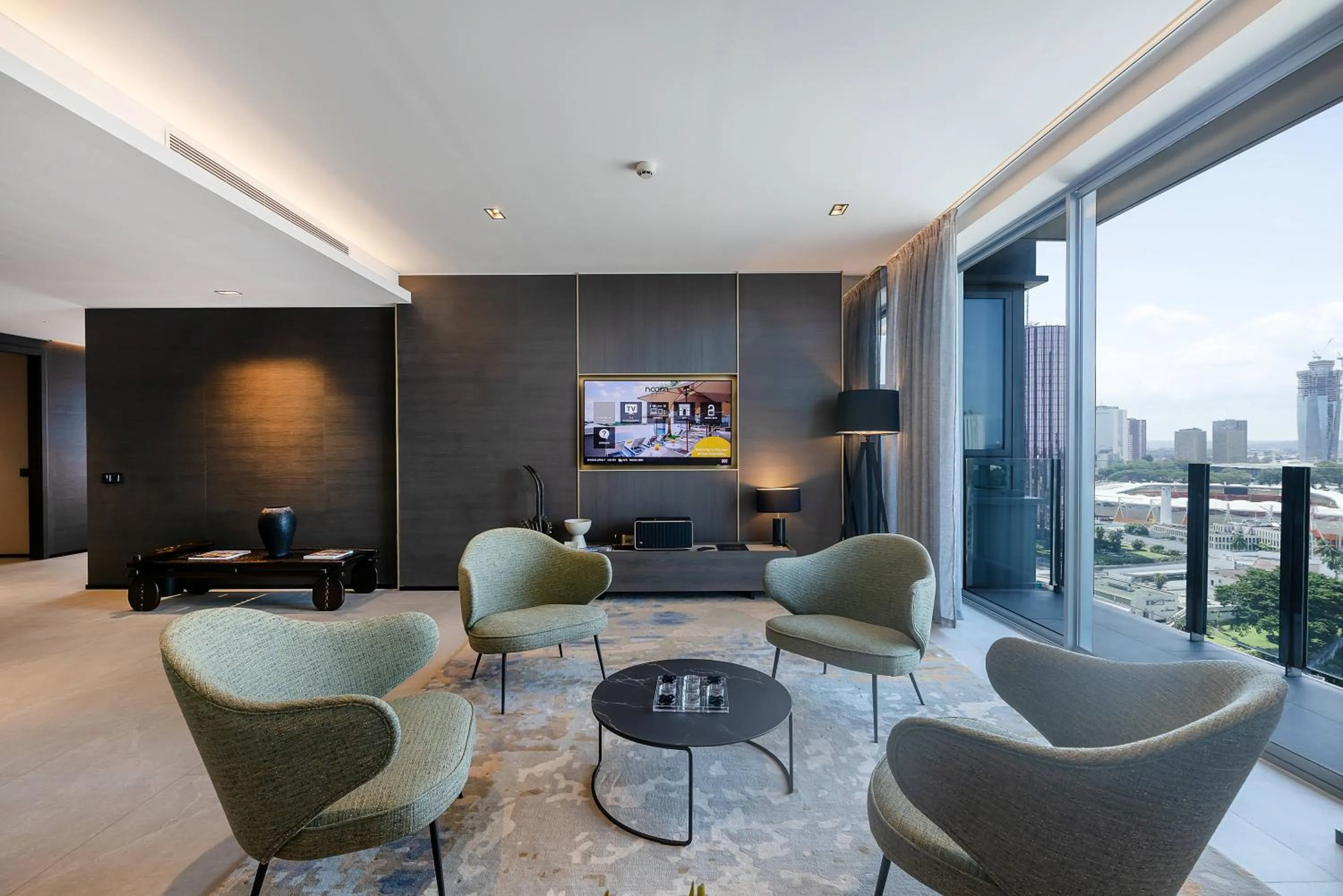Communal lounge/ TV room in Noom Hotel Abidjan Plateau