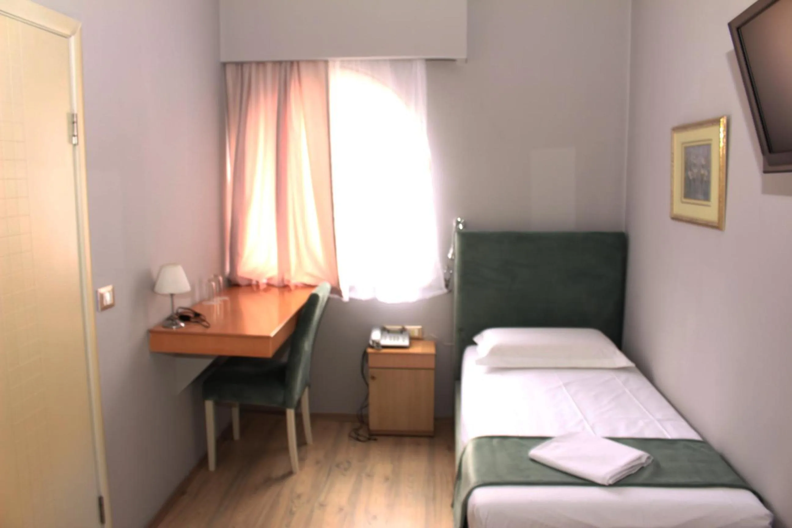 Bed in Theranda Boutique Hotel