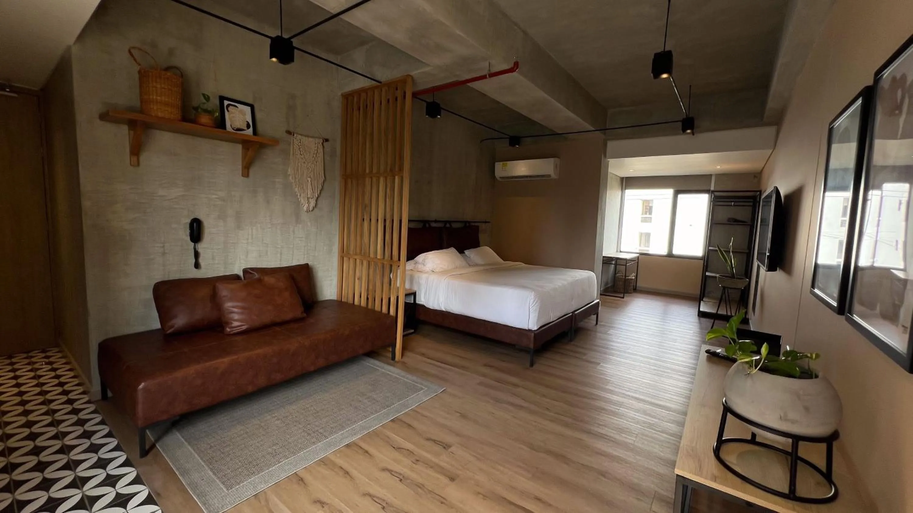 Bed in Mosaic Studios Buenavista