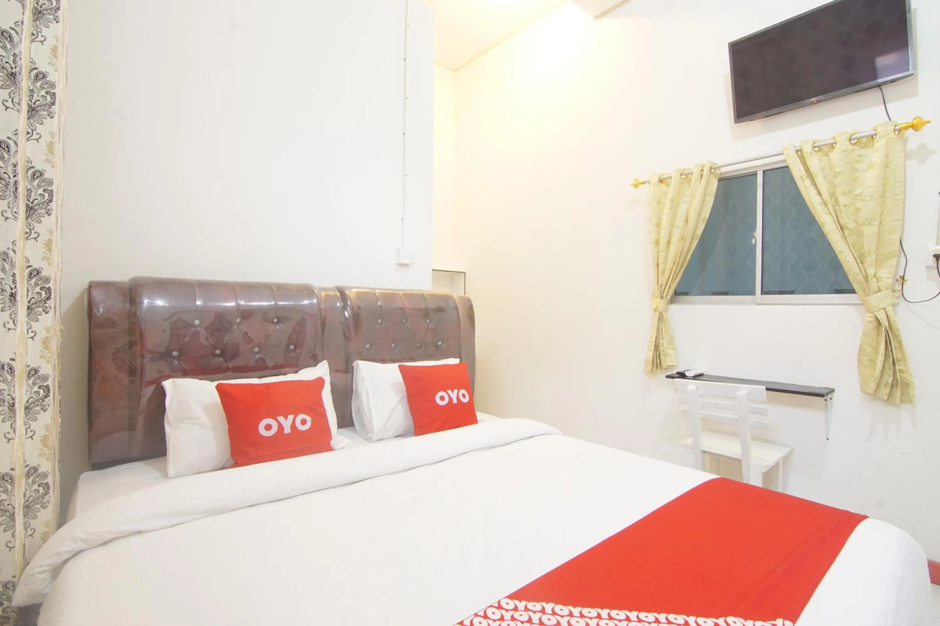 Bedroom in OYO 90615 Jojo Homestay