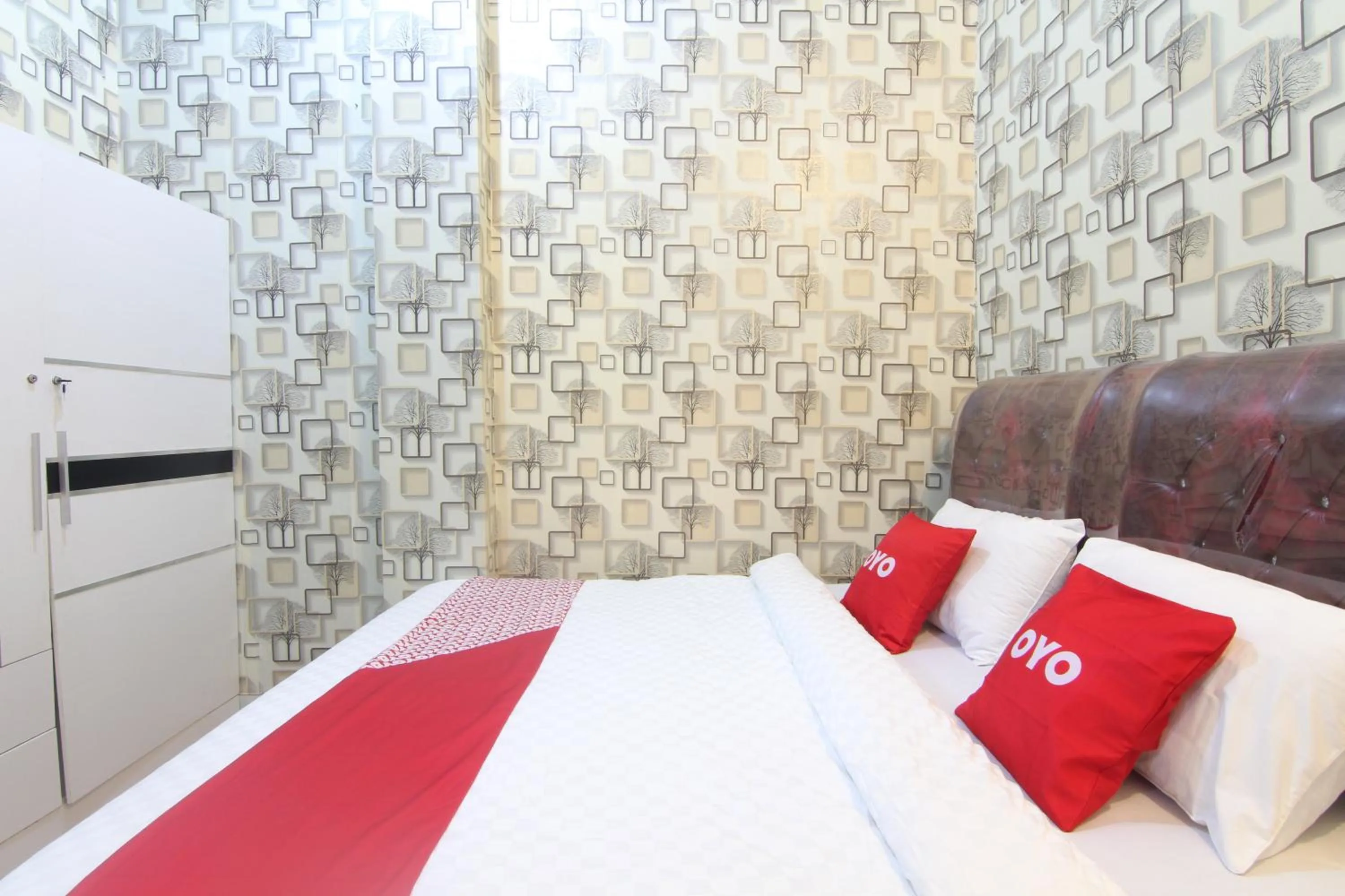 Bedroom in OYO 90615 Jojo Homestay