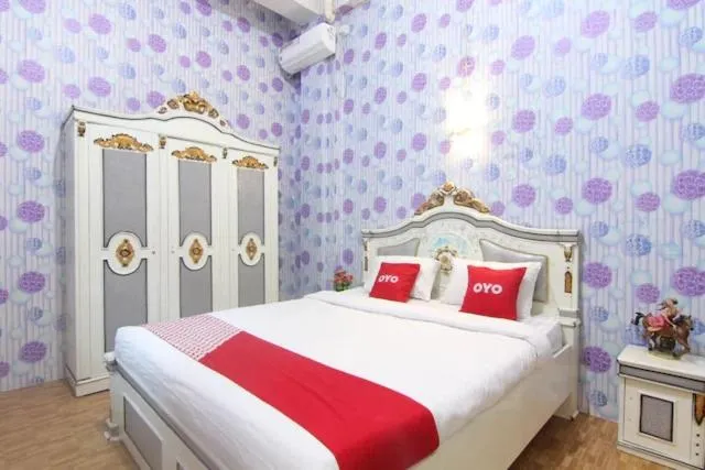 Bedroom in OYO 90615 Jojo Homestay