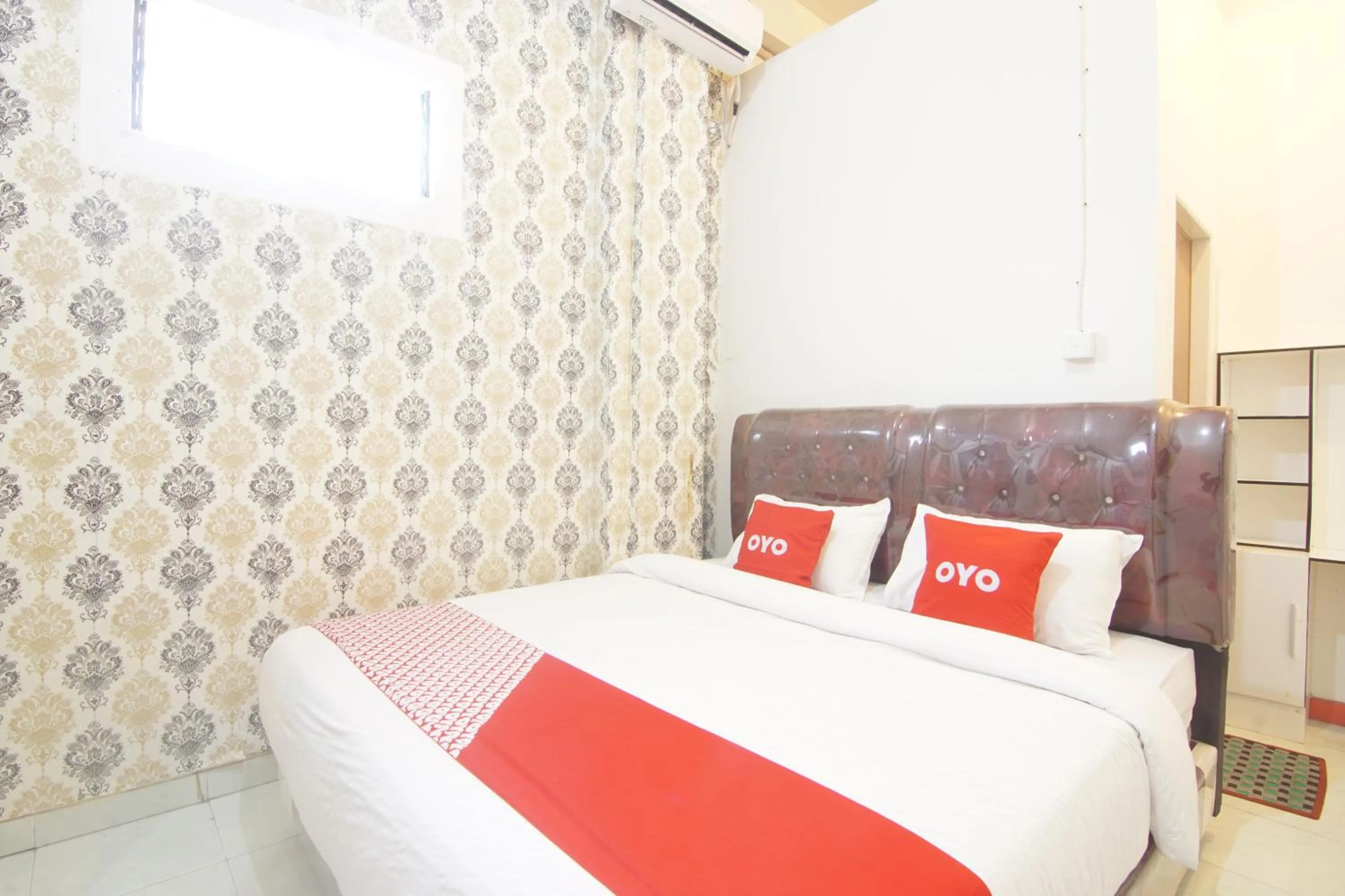 Bedroom in OYO 90615 Jojo Homestay