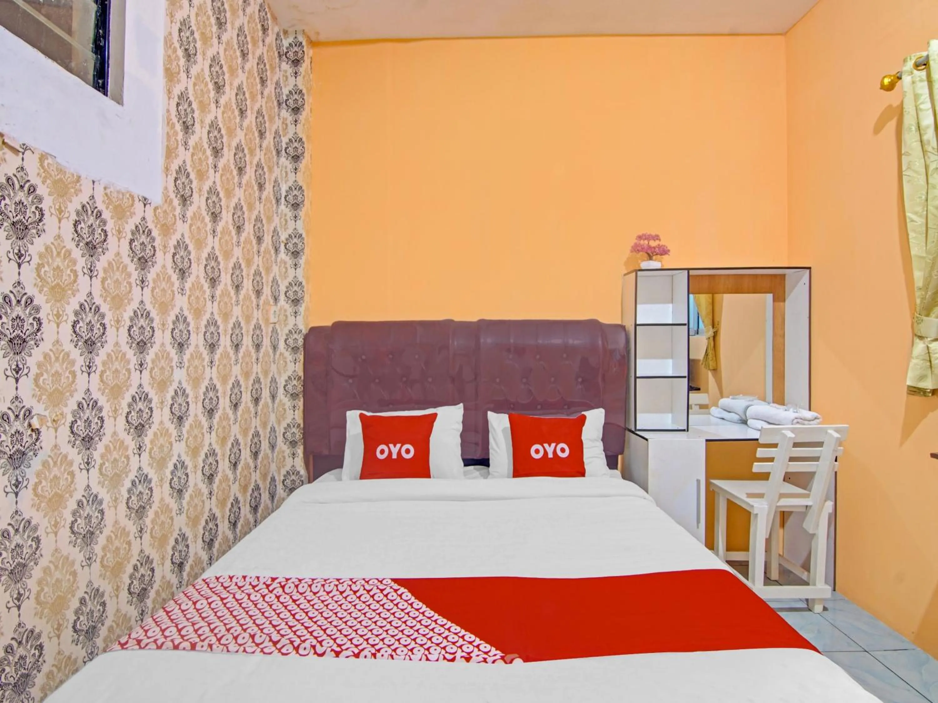 Bedroom in OYO 90615 Jojo Homestay