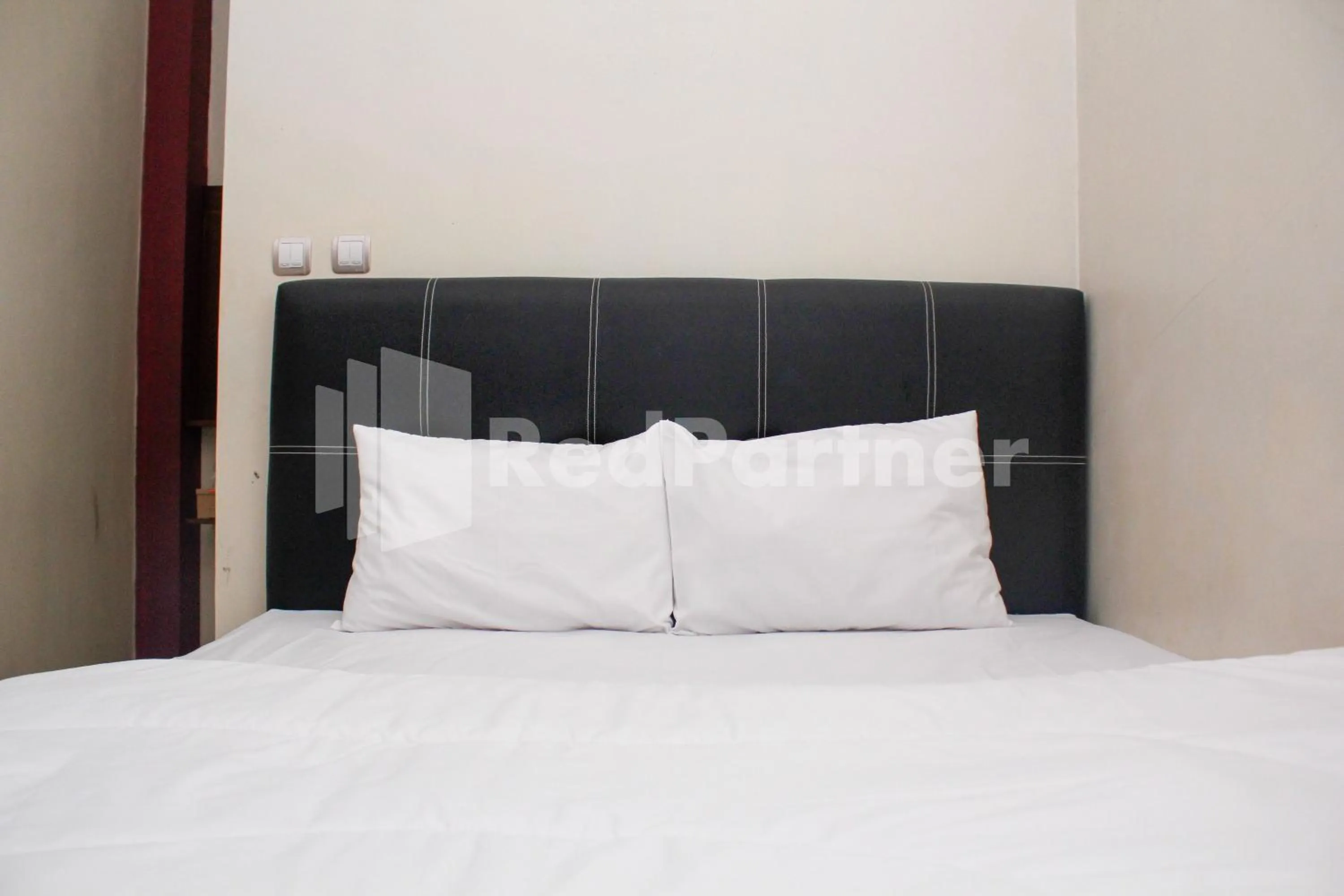 Bed in Hotel Baby Angel Dieng Mitra RedDoorz