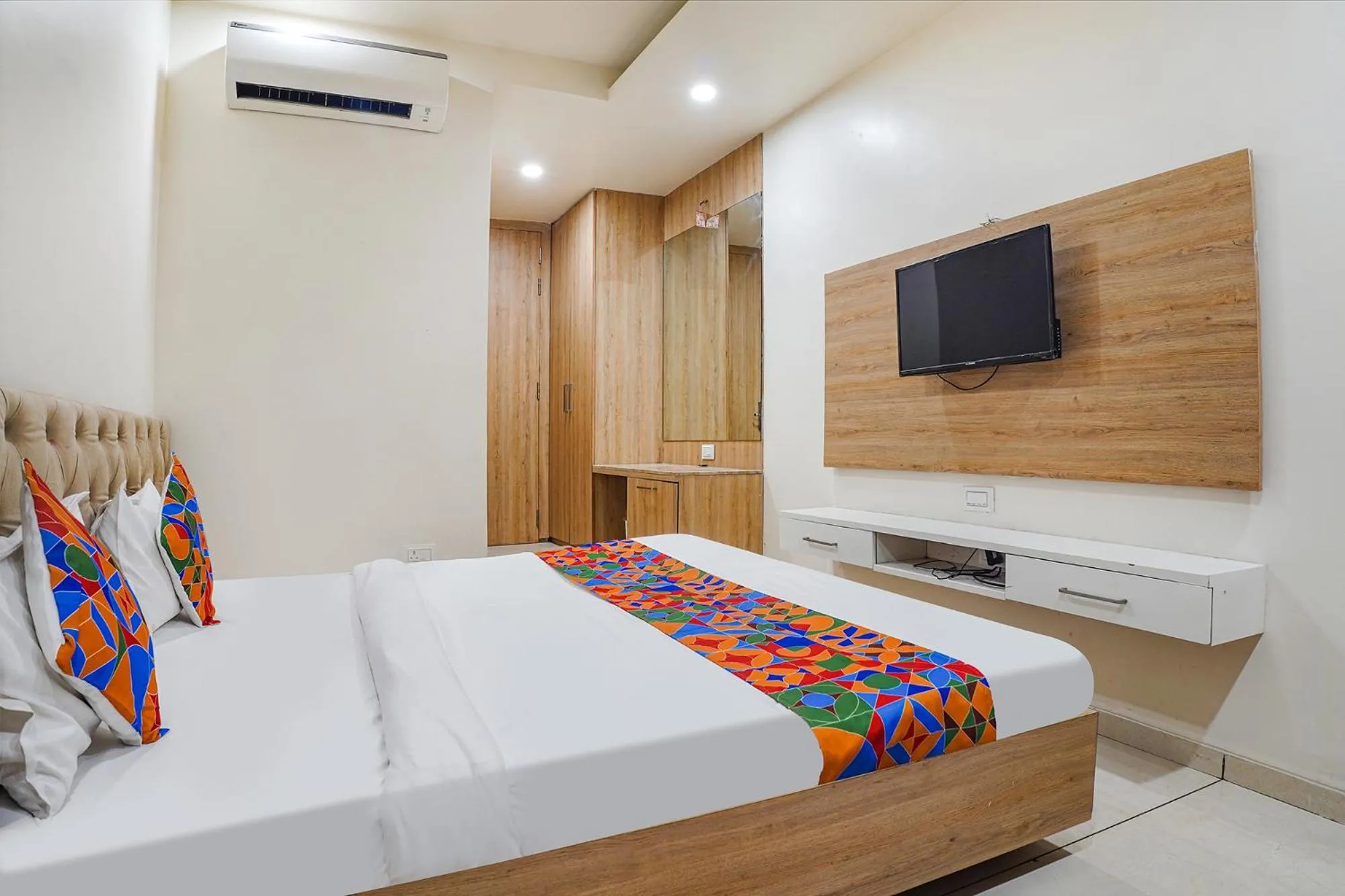 Bed in FabHotel Prime OM Palace