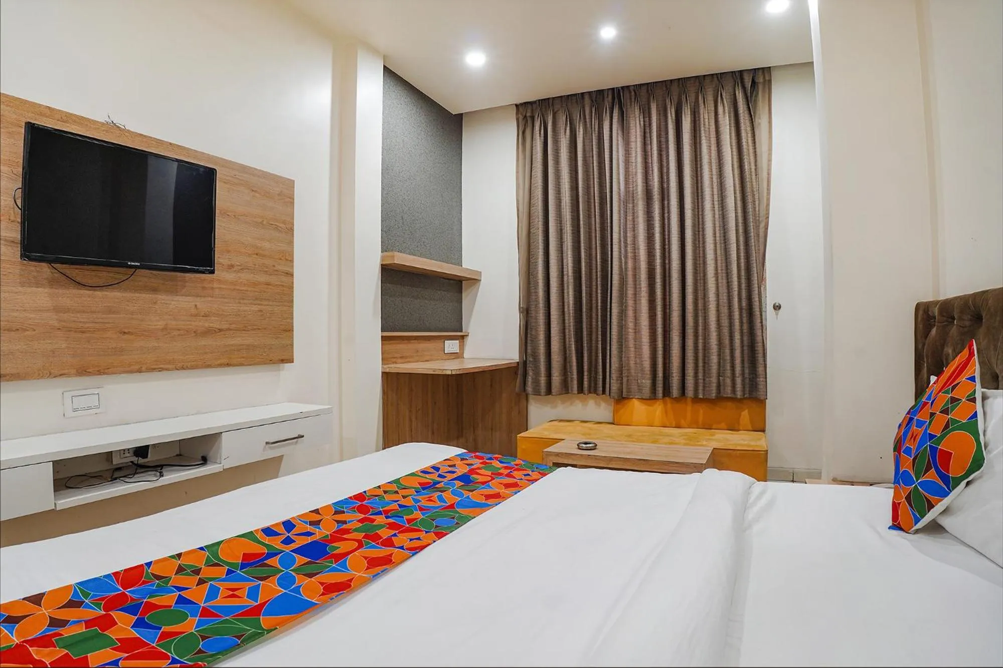 Bed in FabHotel Prime OM Palace