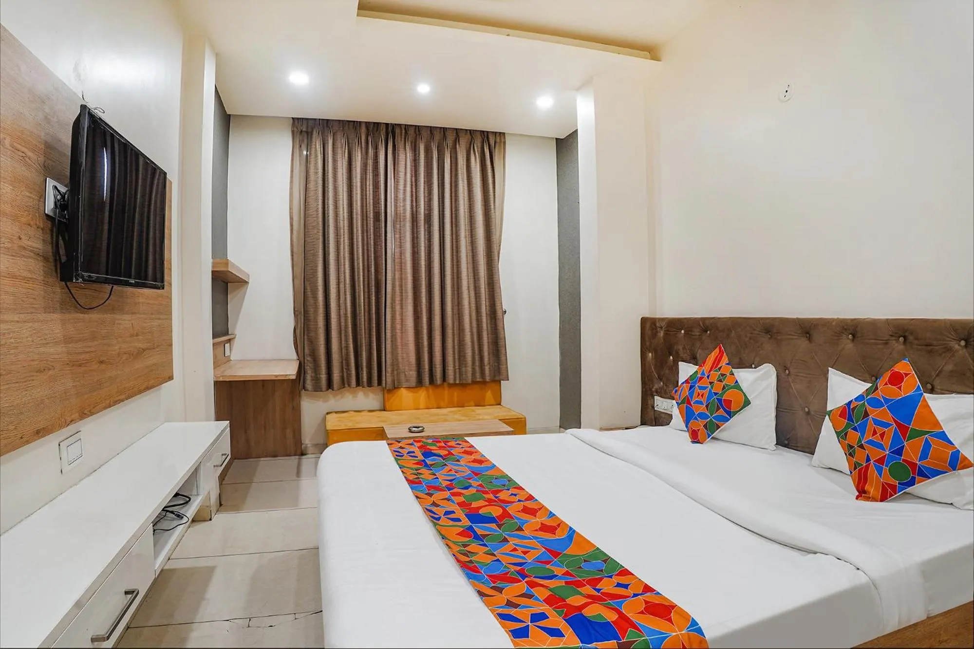 Bed in FabHotel Prime OM Palace