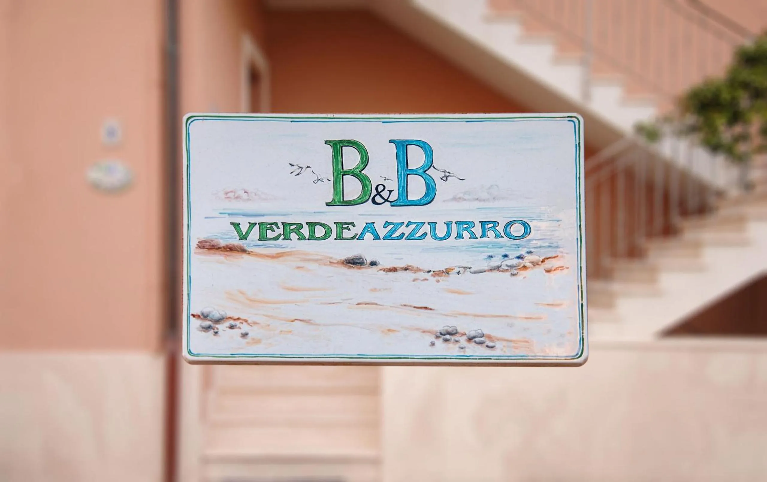 Property logo or sign in Bed and Breakfast Verde Azzurro