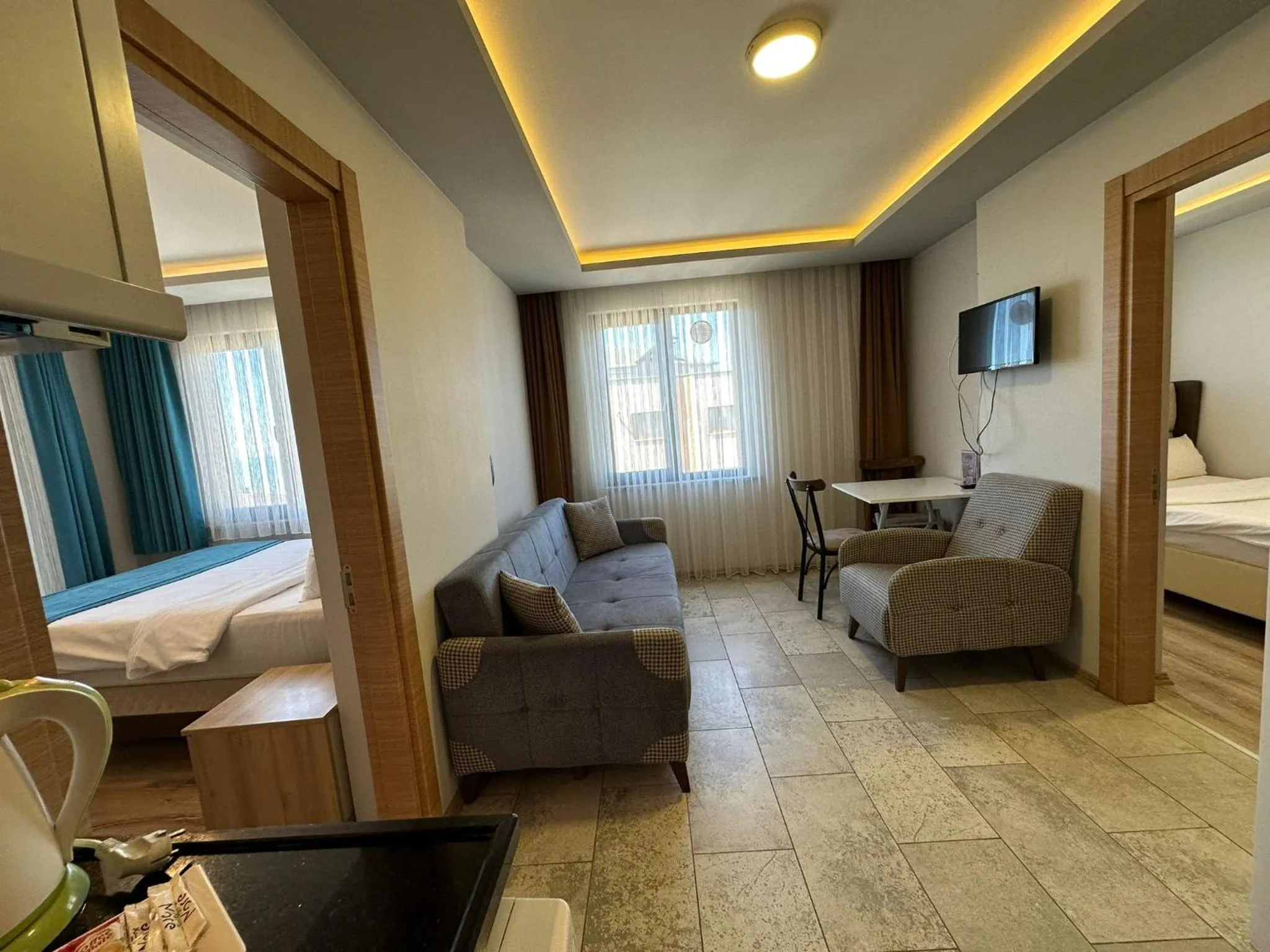 Communal lounge/ TV room, Bed in Trabzon Gloria Suite Hotel