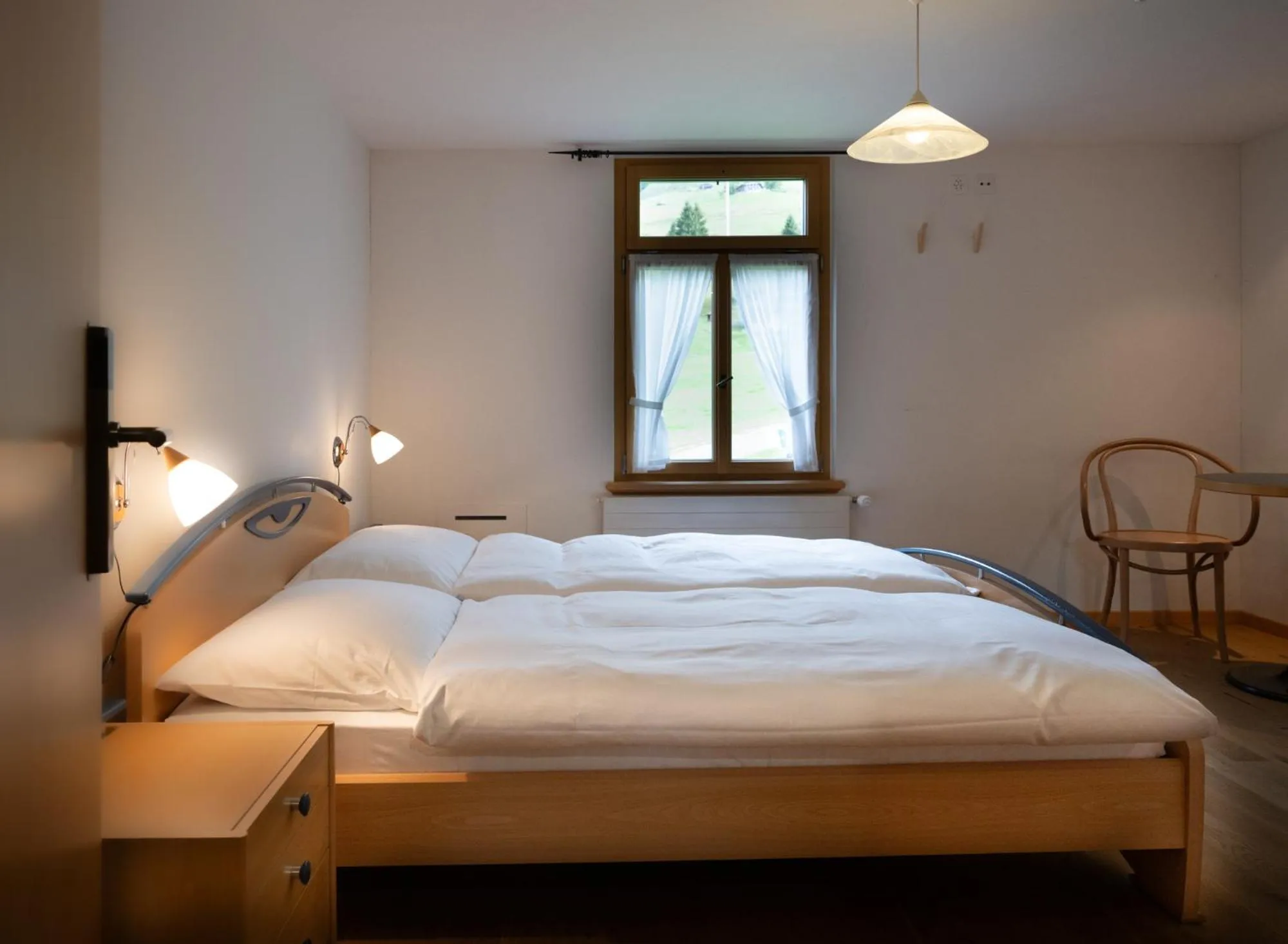 Photo of the whole room, Bed in FLÜHLI Hotel Kurhaus